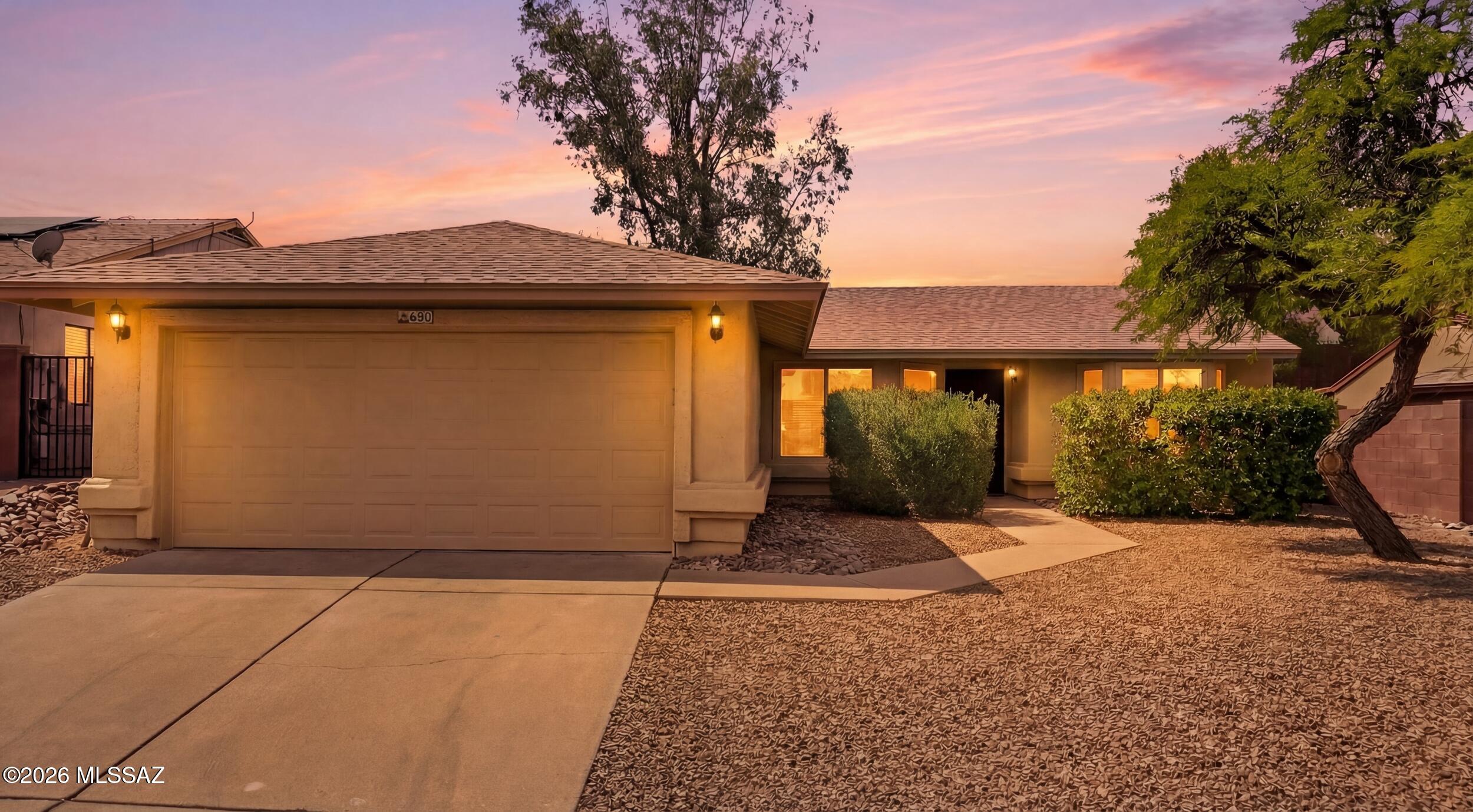 Beautifully updated throughout, this home offers a bright, open floor plan with a modern kitchen that flows into the family room. The kitchen features granite countertops, gray cabinetry, and stainless steel appliances, including a built-in microwave, range, dishwasher, and refrigerator. Both bathrooms have been renovated with tiled showers and upgraded fixtures. The wraparound backyard offers privacy and includes a covered patio with bar area and raised planters. Additional highlights include a 2-car garage roof replaced in 2025, exterior paint in 2025, HVAC 2011, Condenser in 2021, water heater 2018. Located near desirable shopping, restaurants, and schools. Community access to a pool, lap pool, heated spa, gazebo, and picnic