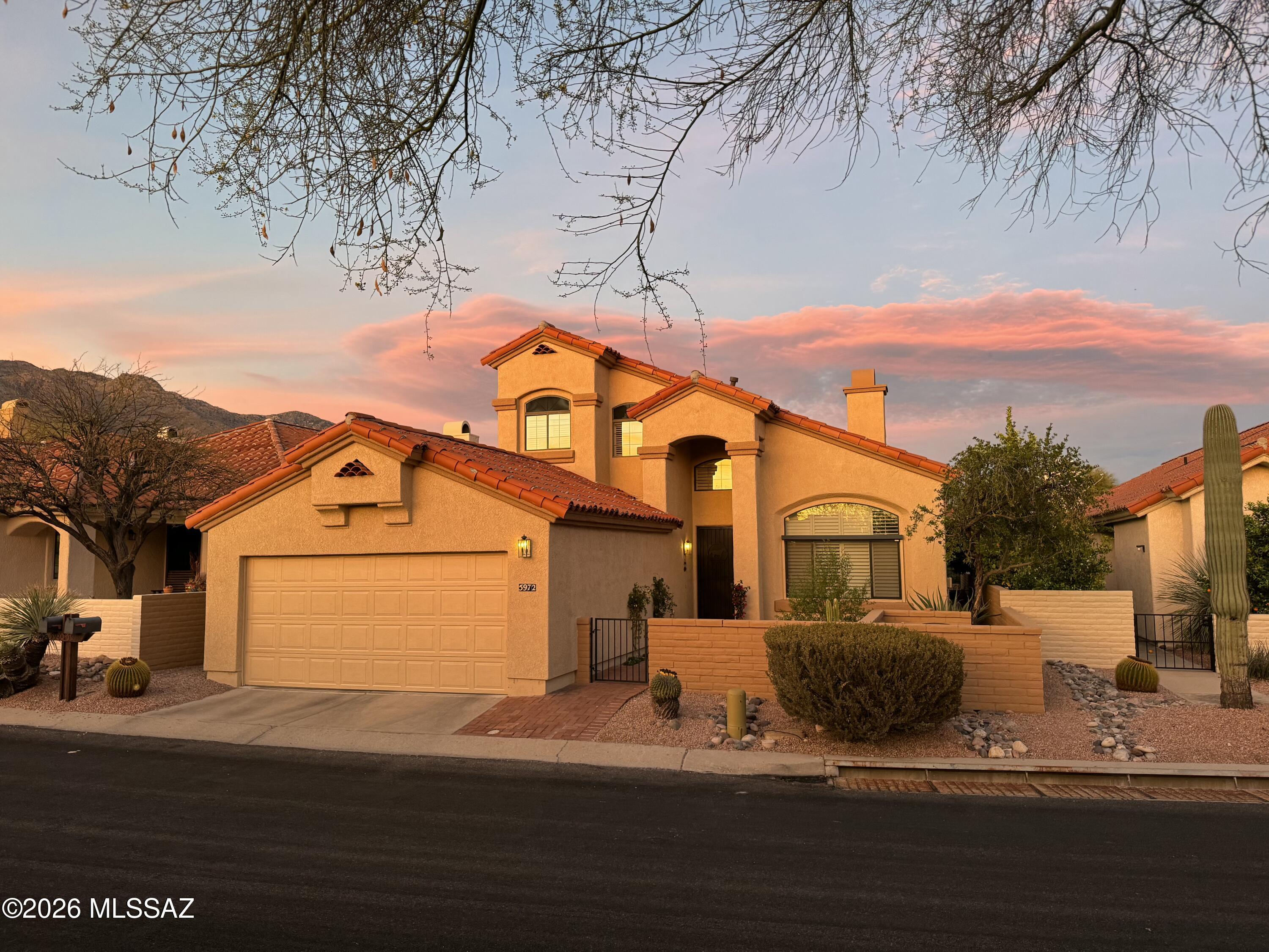 Enjoy the best of resort style living in Prestigious La Paloma.  Located in Ridge 4, this elegant 4-bedroom, 2-bathroom home offers 12-foot ceilings in most areas, 16-foot ceiling in living room, breathtaking views of the Catalina Mountains and much more! Newly updated kitchen features new stainless-steel appliances, updated cabinets, and an island with a gas cook top. If natural light is what you should desire, this home has it all. Whether you sit in the formal living room, dining room or just want to take it easy in the family room you can enjoy tons of natural light, or you could close the plantation shutters to give you a serene environment. Enjoy the best of desert living as you sit on your private balcony and take in the views. The garage was extended giving you more space for larger vehicles. This wonderful community offers a guarded gate, golf, a rec center, private pool for Ridge 4, and tennis with a membership fee. Live your best life in the very best the desert has to offer!