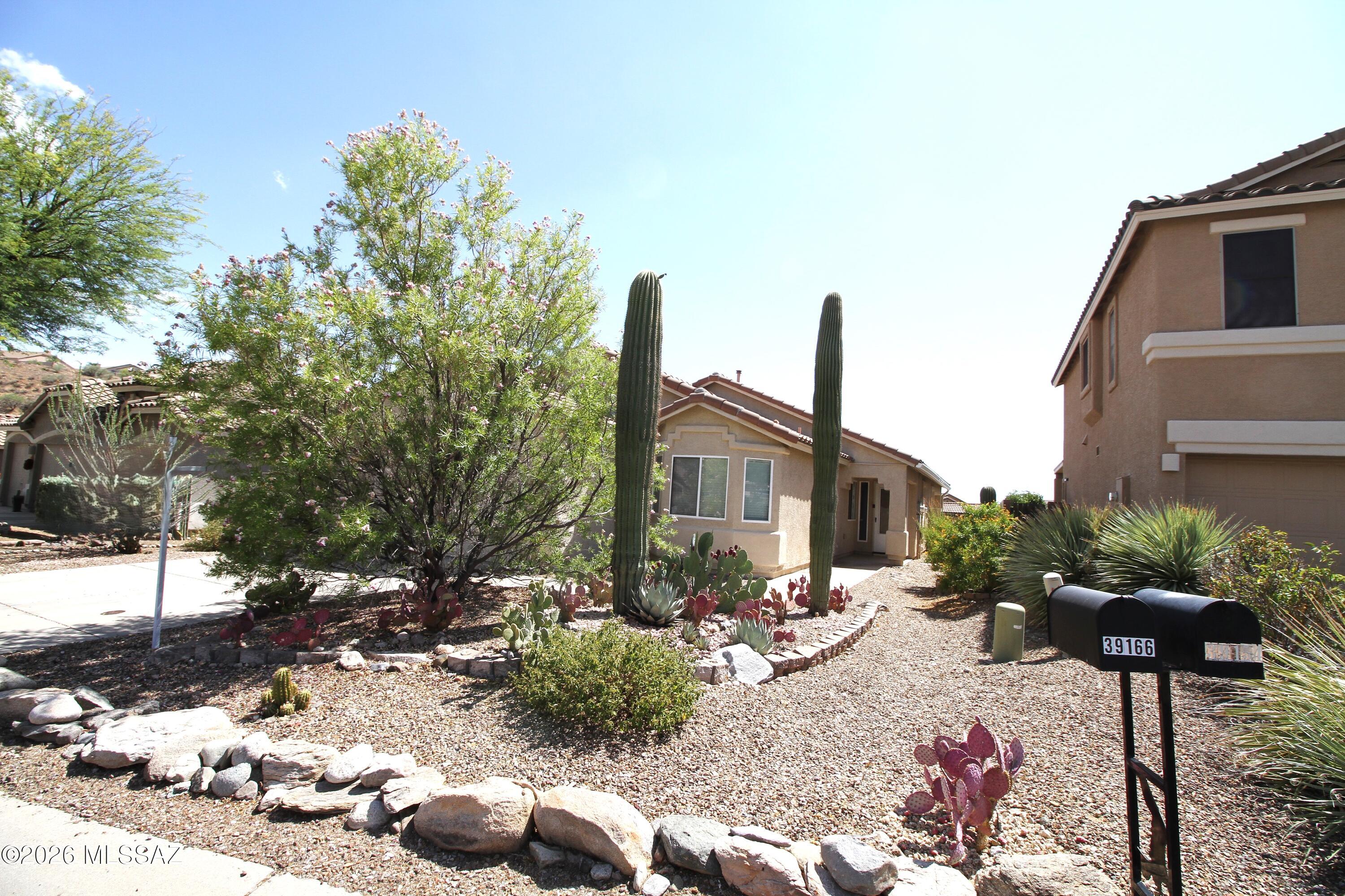 Fully Paid OFF - Solar System.  Wonderful contemporary home in Eagle Crest Ranch. 3 bedroom, 2 bath plus den. Split bedroom plan, open floor plan, 2 car garage and private backyard with trees and a Rain Water Bucket in Backyard to water trees.