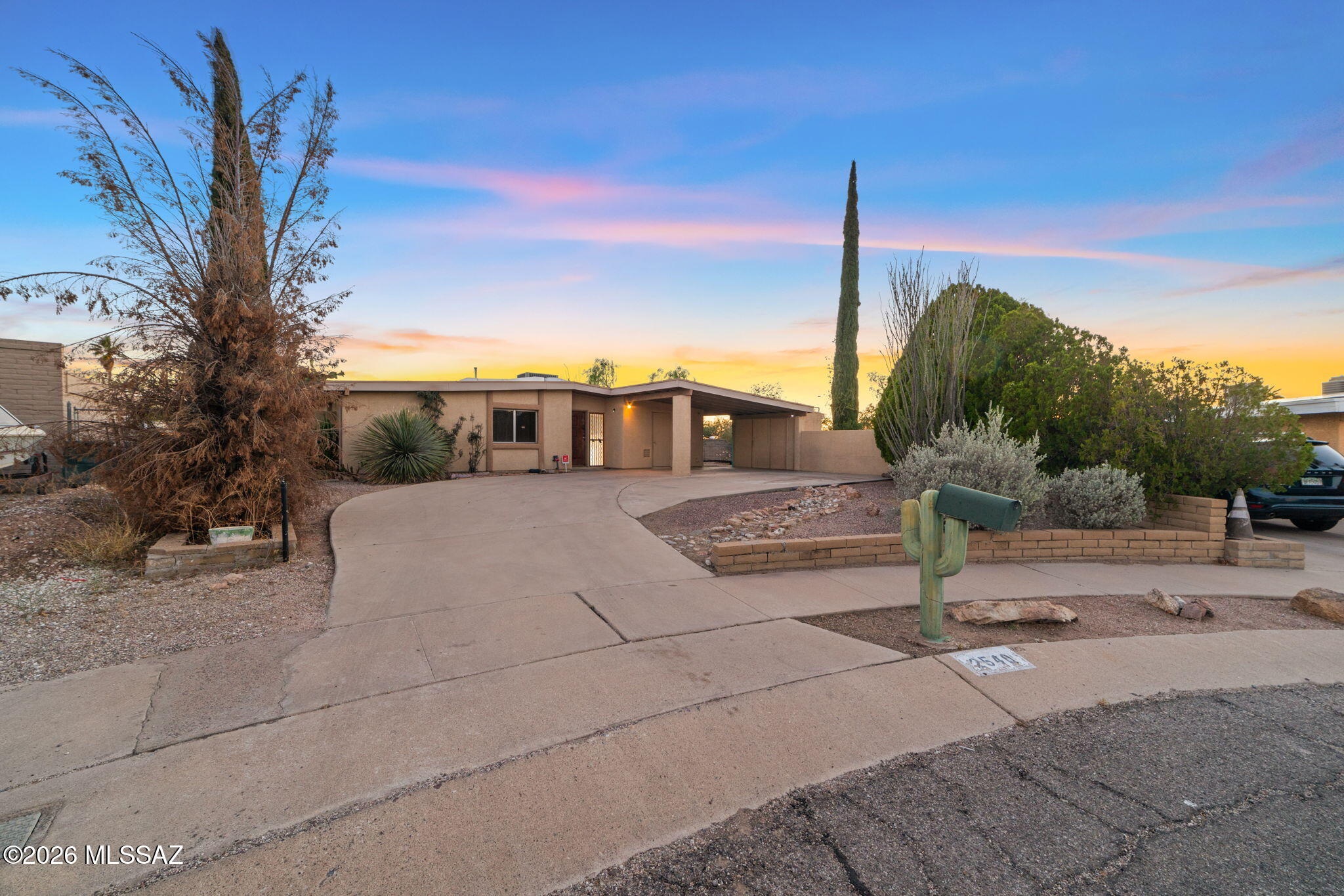Move-in ready 3 bedroom, 2 bath home featuring all new interior paint with warranty, new carpet, and updated bathroom vanities. Step through the welcoming foyer into a bright and refreshed living space where modern updates blend seamlessly with Tucson charm. The thoughtfully designed floor plan offers comfortable everyday living and inviting spaces for gathering with family and friends. Enjoy meals in the eat-in kitchen or relax in the spacious living room, perfect for entertaining. Outside, the backyard is built for Arizona living with a sparkling pool, plenty of room to host guests, and a separate poured concrete parking slab with alley access ideal for trailers, recreational vehicles, or additional parking. Conveniently located near schools, shopping, dining, and everyday amenities.
