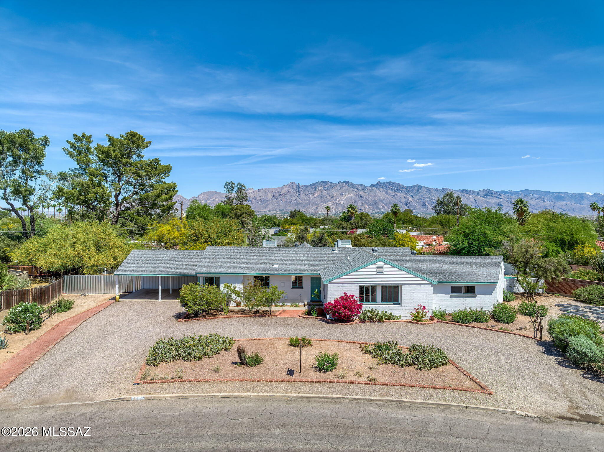 Tucson's most beloved historic neighborhoods offer something rare -- wide streets and generous lots with mature trees that feel almost suburban, yet you're just steps from the Arizona Inn, the University of Arizona, Banner Hospital, and some of the city's best dining and recreation. Catalina Vista within the Blenman-Elm area delivers all of it, and this home sits at its very heart.

Perched at the north apex of Waverly Circle Park, this sprawling 1954 midcentury ranch commands one of the neighborhood's most coveted positions. At over 3,300 square feet, the home has retained much of its original character -- the kind of authenticity that's increasingly hard to find in a home of this era. A generous pool and outdoor space are tailor-made for long Tucson summers, weekend gatherings, and the easy indoor-outdoor living this climate invites.

The seller has invested thoughtfully in the infrastructure: new Bosch Inverter HVAC systems, updated ductwork, and replaced and lined sewer lines -- the unglamorous but critical work that gives the next owner a clean foundation to enjoy the home as-is or make it entirely their own.