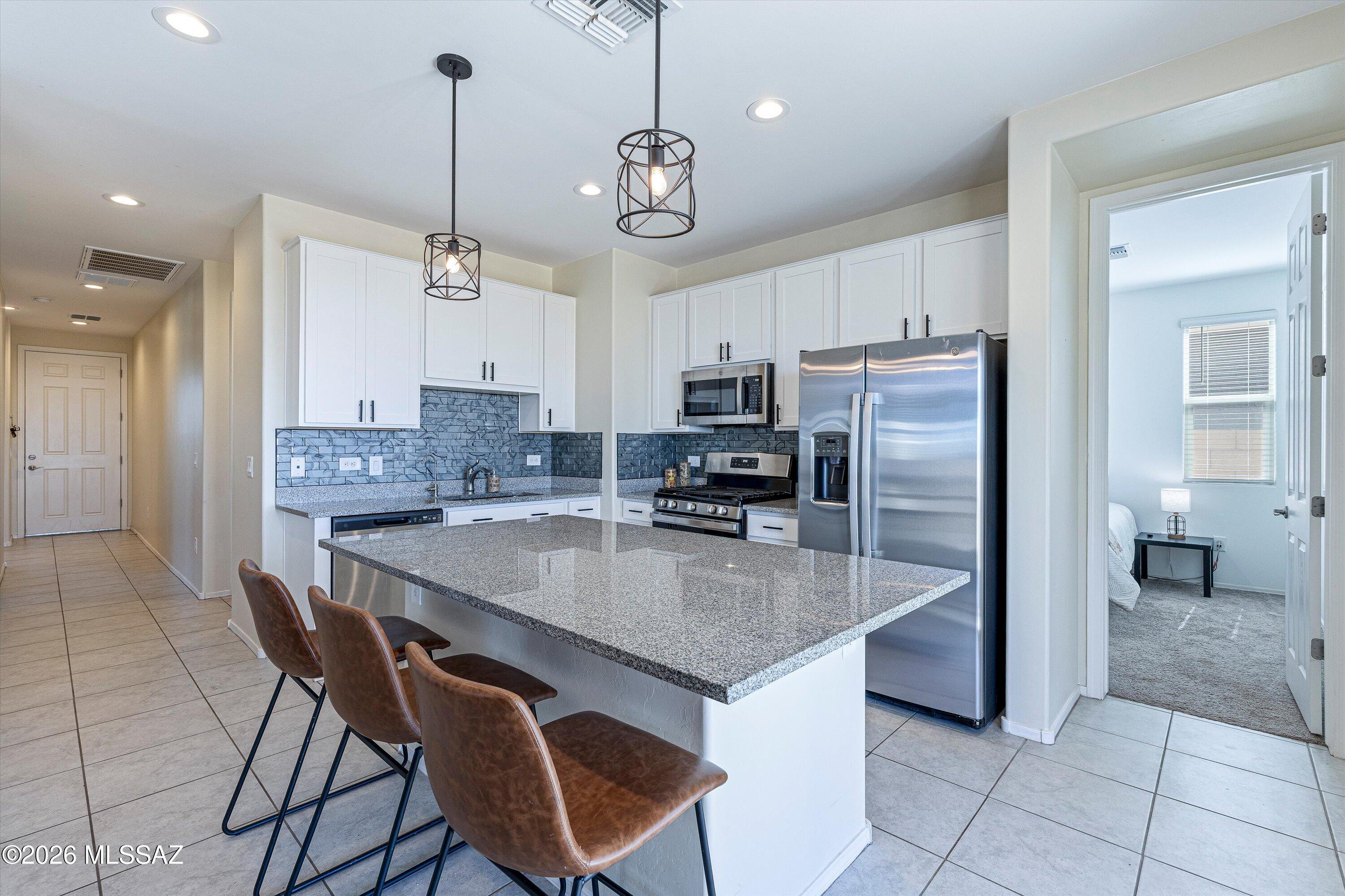 INCREDIBLE VIEWS WITH NO BACK NEIGHBORS! This beautifully designed Cypress floor plan by Richmond American Homes offers 1,120 square feet of thoughtfully laid-out living space with 3 bedrooms, 2 baths, and a bright, open great room that flows effortlessly into the kitchen with a center island perfect for morning coffee or hosting friends. The owner's suite features a generously sized walk-in closet and a private en-suite bath. Red Rock isn't just a place on the map it's a slice of Sonoran Desert history. Long before it became a growing residential community, this land was home to the Sobaipuri and Tohono O'odham peoples who farmed along the nearby Santa Cruz River, and the surrounding valley holds some of the oldest evidence of irrigation and agriculture in North America. Today, that same rugged, wide-open desert character remains. This is more than a house it's a foothold in one of Southern Arizona's most authentic and up and coming desert communities. Don't miss your chance to call Red Rock home. Schedule your showing today!