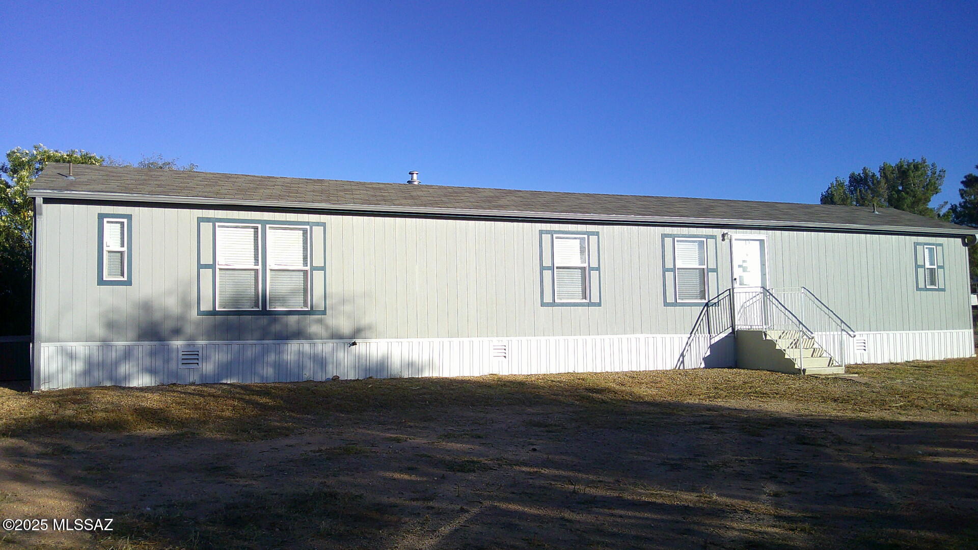 Newer singlewide 3 bedroom, 2 bath manufactured home.  Corner lot with water company and paved street.  Split bedroom plan with master walk in closet.  200 amp service and AC.  Yard enclosed with chain link fence.  Minutes from I-10 and access to Benson and Tucson.  Affordable housing compared to Tucson market.  Take a look.