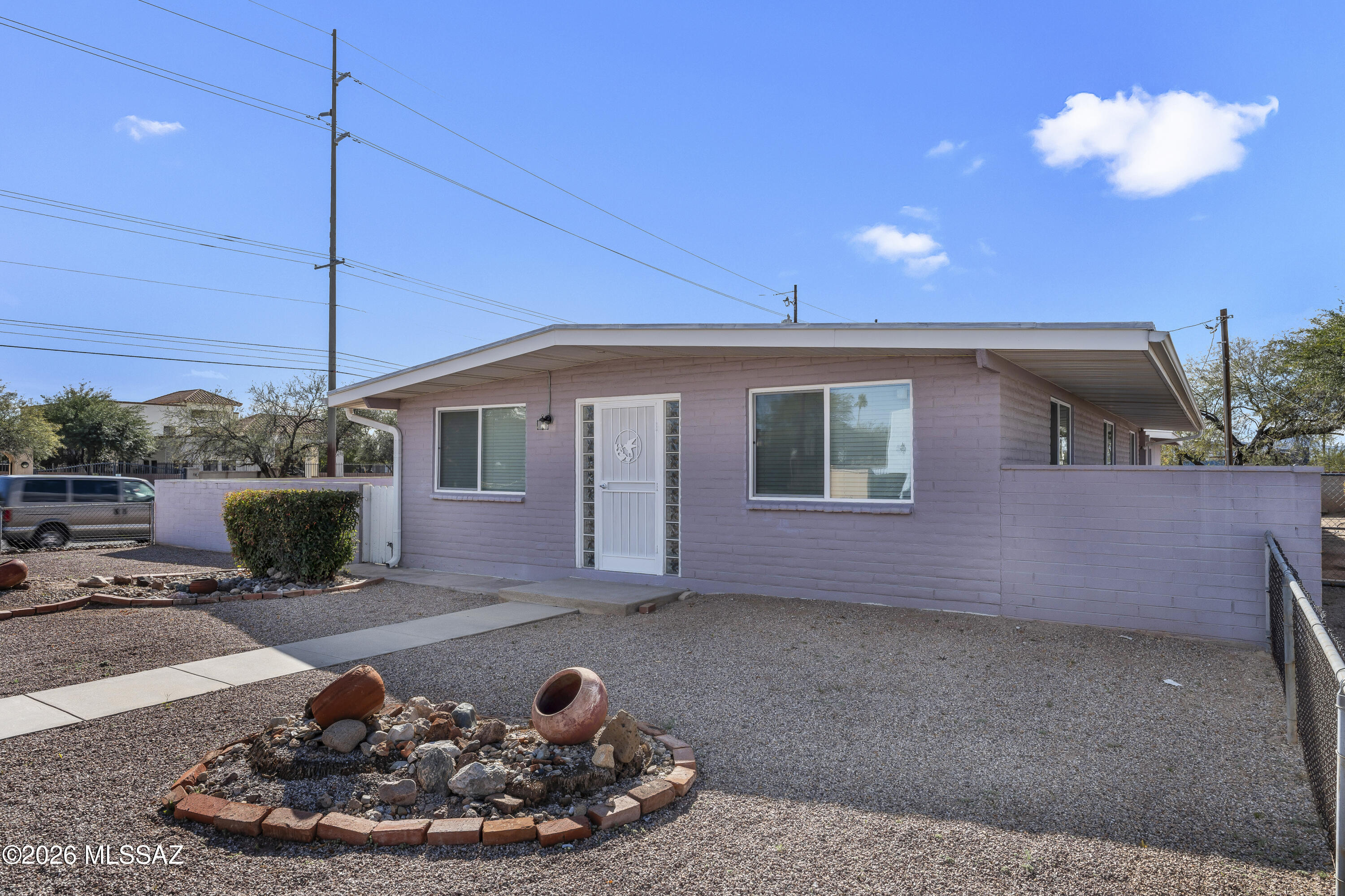 Bring All Offers Seller Stated! Mid-Century Modern Gem in Richland Heights. Fabulous 3-bedroom, 2-bath home in one of Tucson's most desirable central neighborhoods! Offering approximately 1,400 square feet, this classic mid-century residence features a spacious living room filled with natural light and a large kitchen complete with a breakfast bar--perfect for everyday living or entertaining. The low-care side yard is ready for your personal touch, whether you envision a desert oasis, garden retreat, or outdoor entertaining space. Enjoy unbeatable convenience--walk to grocery stores, restaurants, and the bus line, and just minutes from the University of Arizona and downtown Tucson. Ideal for first-time buyers and/or mid-century design enthusiasts.