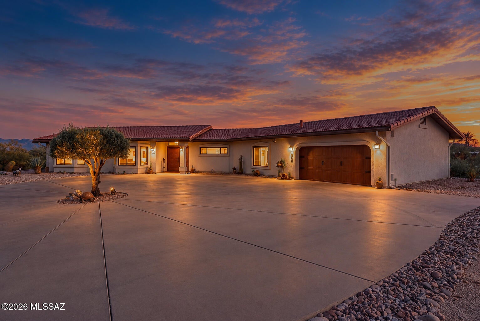 Come home to The Birds Nest, where space and spectacular mountain views welcome you. On 3.16 acres, positioned on a slightly elevated hillside, this special property offers a peaceful setting with plenty of privacy. A large circular driveway greets you, while inside, a generous living room provides comfortable space for everyday living and fun. The remodeled kitchen features quartz countertops, two pantries, and convenient pull-outs in most cupboards, while the updated laundry room also features quartz countertops. 3 bedrooms offer flexibility, with one easily serving as a den or home office. The large, covered patio invites you to slow down and enjoy the views. The Birds Nest offers the opportunity to enjoy acreage living without sacrificing comfort and convenience. (RV parking on-site).