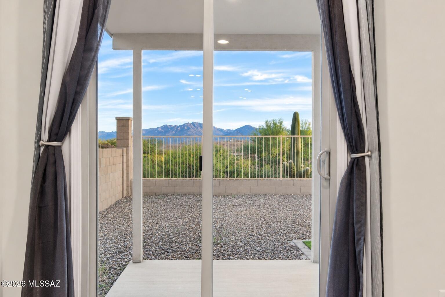 Experience elevated living in this beautifully maintained 2023 home in Rancho Sahuarita. This Elevation B home sits at the highest elevation in the neighborhood, offering beautiful mountain views. Ideally positioned with no homes directly behind, offering enhanced privacy and an open feel.

Inside, the thoughtfully designed 4 bedroom, 4 bath layout features an open concept main living area, plenty of natural light, a spacious walk-in pantry as well as a spacious 3 car tandem garage featuring durable epoxy flooring designed for both style and everyday use. A true highlight of the home is the attached NextGen suite, thoughtfully designed as a private space within the home. With its own entrance and complete living accommodations, including a living room, laundry, kitchenette, bedroom and bathroom. Offering the flexibility to comfortably accommodate family or guests while providing the privacy and independence of separate living spaces.

Beyond your front door, Rancho Sahuarita gives you access to a lifestyle designed to make everyday living feel like a getaway. Enjoy an impressive selection of amenities throughout the community. Enjoy resort style pools and a full scale water park, a peaceful lake, horseback riding, fitness center, basketball court, clubhouse, parks and dedicated dog parks, pickleball courts and miles of scenic walking trails all coming with a full calendar of community events.

Skip the wait of new construction and move right into a beautifully finished home that is ready to enjoy. With its distinctive floor plan, elevated mountain views, a versatile NextGen suite and a community filled with amenities just minutes away. This is a property that truly feels like home. Designed to give you more flexibility, more enjoyment and many more reasons to love where you live making everyday life easier and more enjoyable.