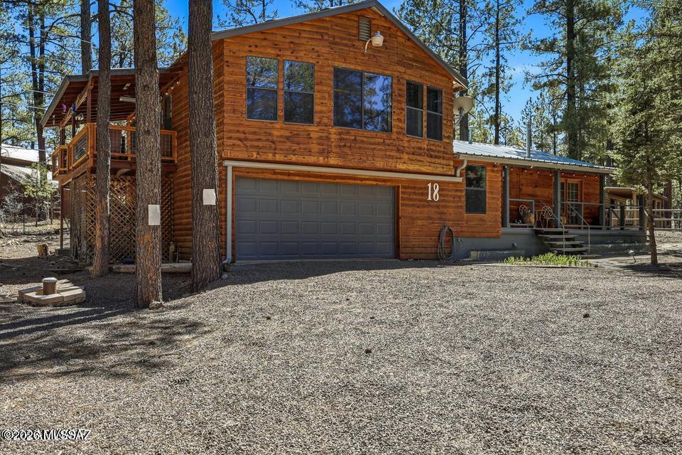 ''Mountain retreat + proven income--this is the Alpine unicorn you've been waiting for.'' If you have been waiting for the Unicorn listing to pop up in our beloved Alpine community, the wait is over. This spacious 4-bedroom 2 bath 1886 square feet home has something for everyone. The current owners have poured their hearts into this one, turning it into a true gem of the area with multiple spaces for everyone's enjoyment. This cabin has been bead blasted and re-stained and sealed, bringing back its original exterior beauty.  The entire upstairs area is one great room with both kitchen and living space in one beautiful entertaining area. The walk out onto the upper deck provides spaces both covered for those raining and snowy evenings or uncovered for quiet mornings sipping coffee while you watch the hummingbirds play. The main story has 3 bedrooms with a large master with its own on suite and French doors that lead to the front deck for quiet time away from the bustle of family and friends when needed. The second bathroom is situated perfectly for guests or family between bedrooms 2 and 3.
The fourth bedroom off of the garage creates a perfect space for the kids to play and get loud. The backyard, which backs up to one unoccupied cabin and the forest, has been worked to create a nice fire pit and sitting area. The two-car garage is a perfect workspace or place to keep cars out of the rain and snow. Its proximity to the golf course one block away makes for a perfect golf excursion. Three of the four bedrooms have all new carpet and flooring, and the upstairs deck has all new custom railing and stairs installed this past year.
The cabin has all new leaf guard gutters and a brand new central heating and air conditioning system installed last year, making for a year-round cozy environment that can be controlled remotely on a phone app. Now, if all this hasn't whet your appetite, this next feature is sure to bring a smile to your face. This cabin has been utilized as a five-star VRBO rental cabin generating an average of $24,000 a year. This number could be much higher, but the current owners block time each month for personal use.
This investment property could be offered as a full turnkey, fully furnished cabin ready to continue generating income for its next owner, taking over existing bookings that continue to grow, or it can be cleaned out presenting a clean slate for your own custom touches. The uniqueness of all of these features combined make it a true unicorn opportunity that does not come along very often.
If this incredible opportunity is what you have been looking for, schedule a viewing today and come experience it for yourself. It is always ready for guests and viewings can be scheduled around current bookings that run throughout the year. You won't be disappointed, and your dream cabin can be enjoyed immediately.
