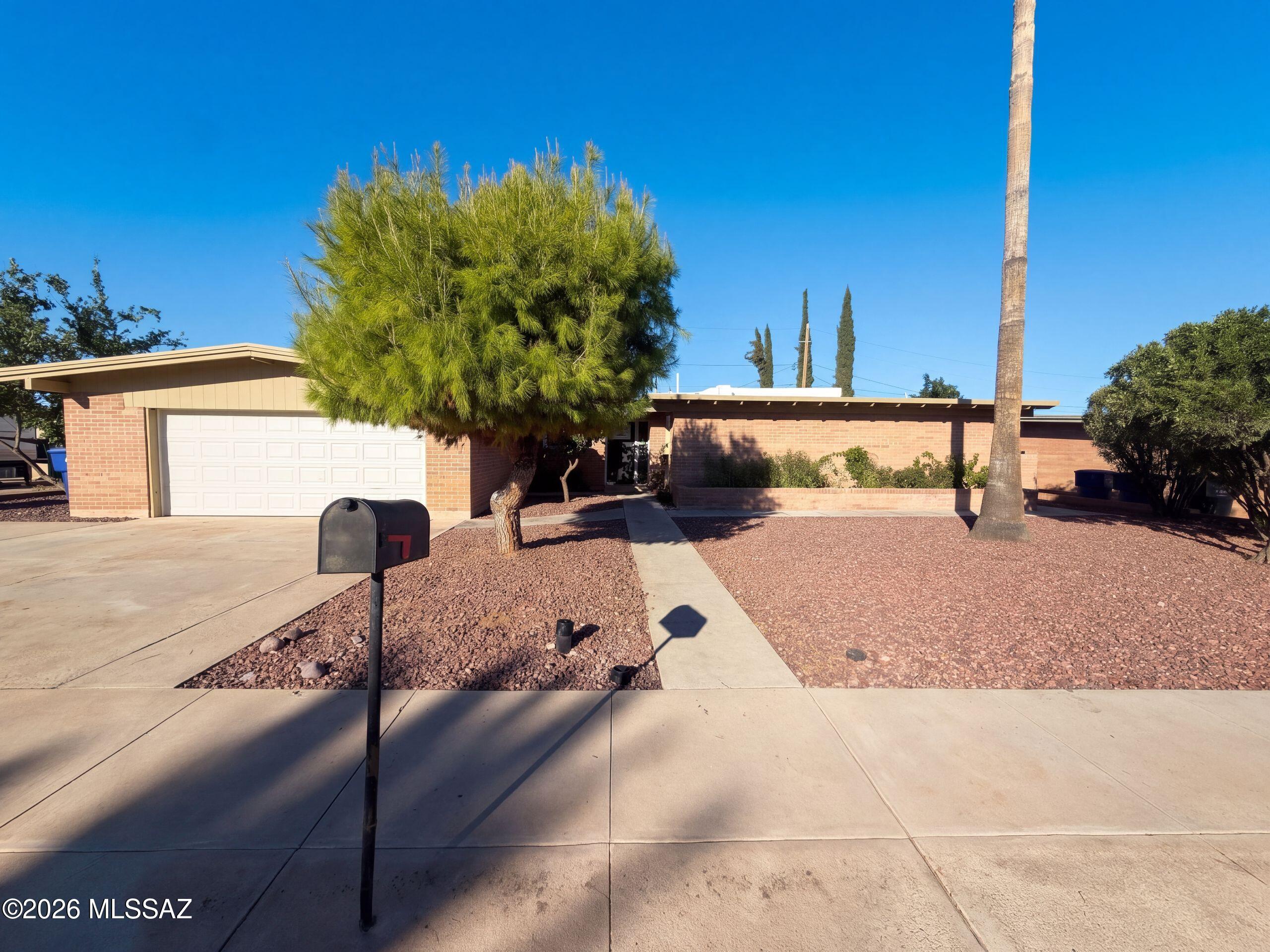 INCREDIBLE BUYER INCENTIVES: $6,000 MORTGAGE CONCESSION. Seller will pay up to $6,000 at closing towards your interest rate buydown if you finance with lender of sellers choice.

100 S Monitor Pl is a one-story Tucson home with four bedrooms and two bathrooms. The kitchen combines a peninsula, generous counter space, and extensive cabinetry for meal preparation and storage, with a skylight bringing in natural light. The main living area connects to the kitchen, while an enclosed rear room with windows on three sides provides additional space for seating or hobbies. Both bathrooms include double sinks, with a tub and shower combination in one and a walk-in shower in the other. Outside, the backyard patio provides space for outdoor dining and seating. A two-car garage completes the home. I