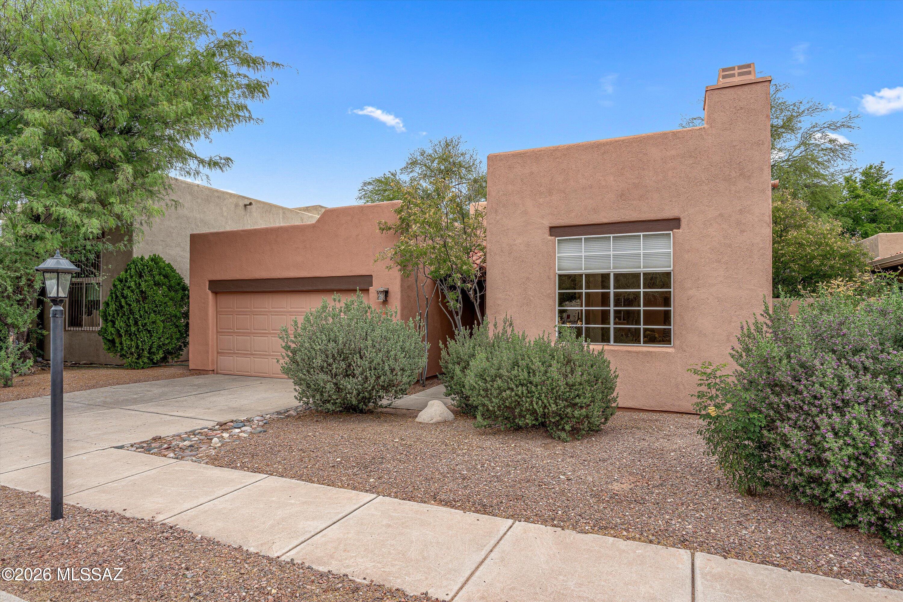 Welcome to this 3 bedroom, 2 bath home in the heart of central Tucson, perfectly situated within walking distance to the Tucson Racquet Club and The Loop. Just minutes from the University of Arizona and the vibrant Campbell Corridor, you'll love the easy access to top restaurants, shopping, and everyday conveniences.  Inside, the home feels bright and airy with high ceilings and abundant natural light. Bamboo flooring adds warmth to the living spaces, while classic Saltillo tile in the kitchen and bathrooms bring character and Southwestern charm. A screened-in patio offers the perfect spot to relax or entertain year-round. HVAC new in 2023.