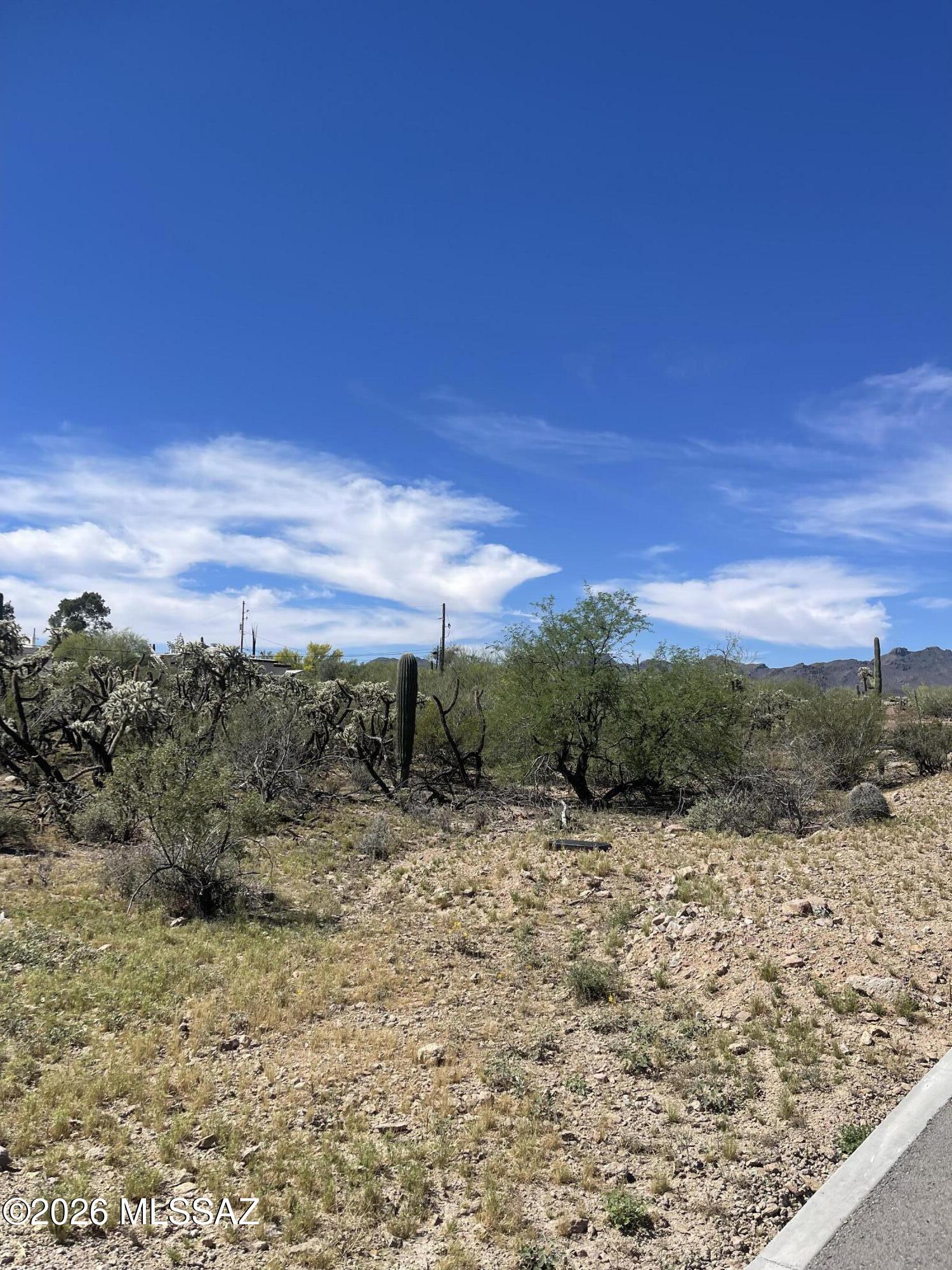 spacious lot located on Tucson's desirable west side. Nestled in a quiet and private setting, this buildable parcel offers stunning desert surroundings.
All utilities at lot line for easy connection.