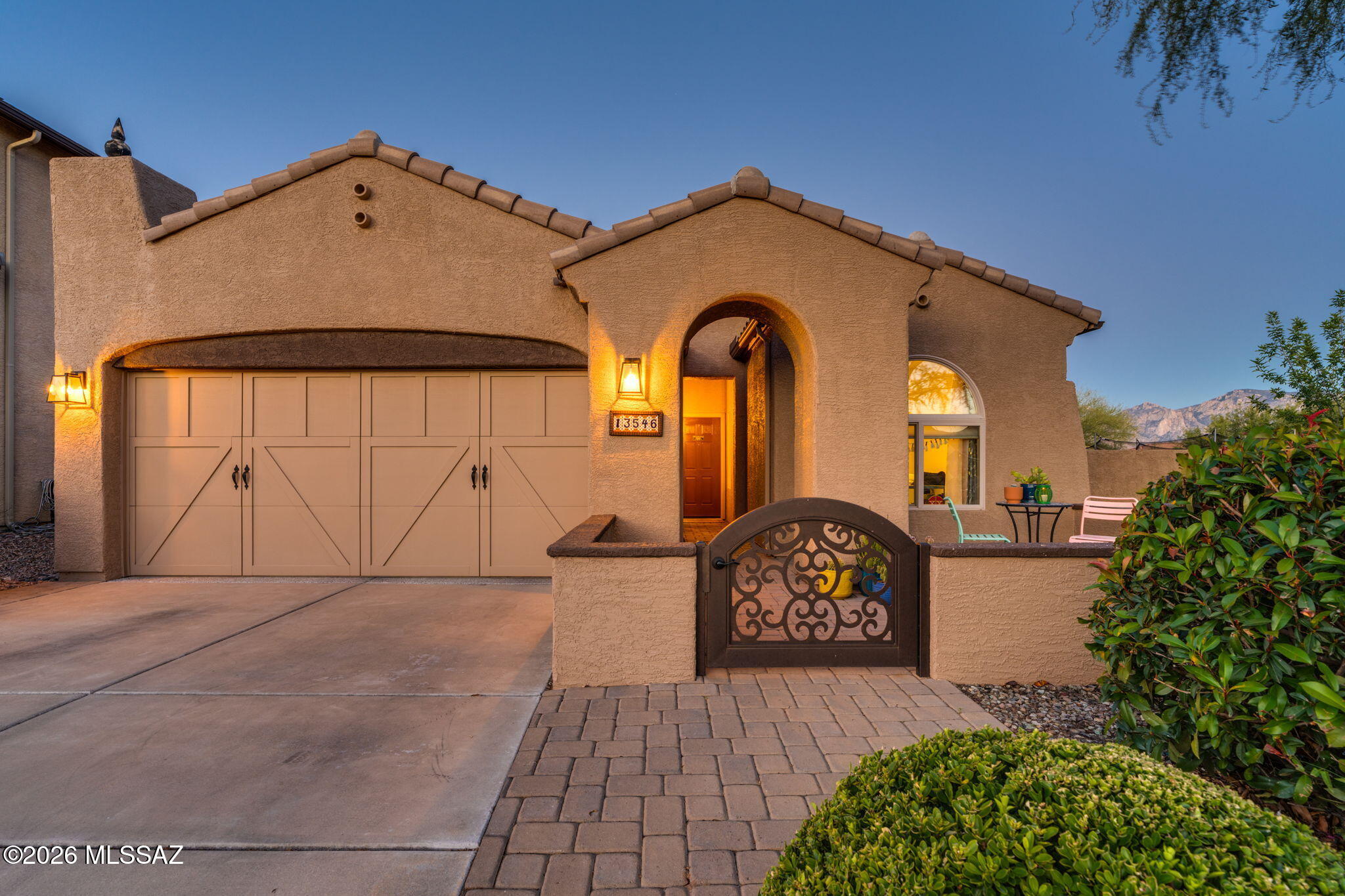 Well maintained & upgraded 2006 Pulte built home located in desirable Monticello at Rancho Vistoso. This single story 4 Bedroom/2 Bathroom, 2,100 Sq.Ft home offers a popular floor plan with great room, dining area & split bedrooms. The kitchen offers beautiful granite counters, staggered cabinets w/soft close & lower roll-outs, and stainless steel appliances including gas range. The spacious primary suite offers separate garden tub & walk-in shower, dual vanities & closet w/amazing Closet Trends custom built-ins. The home features diagonal laid large ceramic tile throughout (no carpet), stack stone fireplace w/mantle, multiple ceiling fans & over-sized windows looking out to the exterior living space. The .20 acre corner lot provides oversized exterior space creating ENHANCED OUTDOOR LIVING. The backyard & side yard include a built-in natural gas BBQ w/island & seating, pavers, custom ramada w/ceiling fan & electric, gas firepit, designer yard art, potted plants w/irrigation, trampoline, artificial turf & easy-care designer-like landscaping. All this and Catalina Mountain views from the backyard and side yard.  A wonderful park offering picnic tables with barbecue, basketball court and playground are just a block away.
