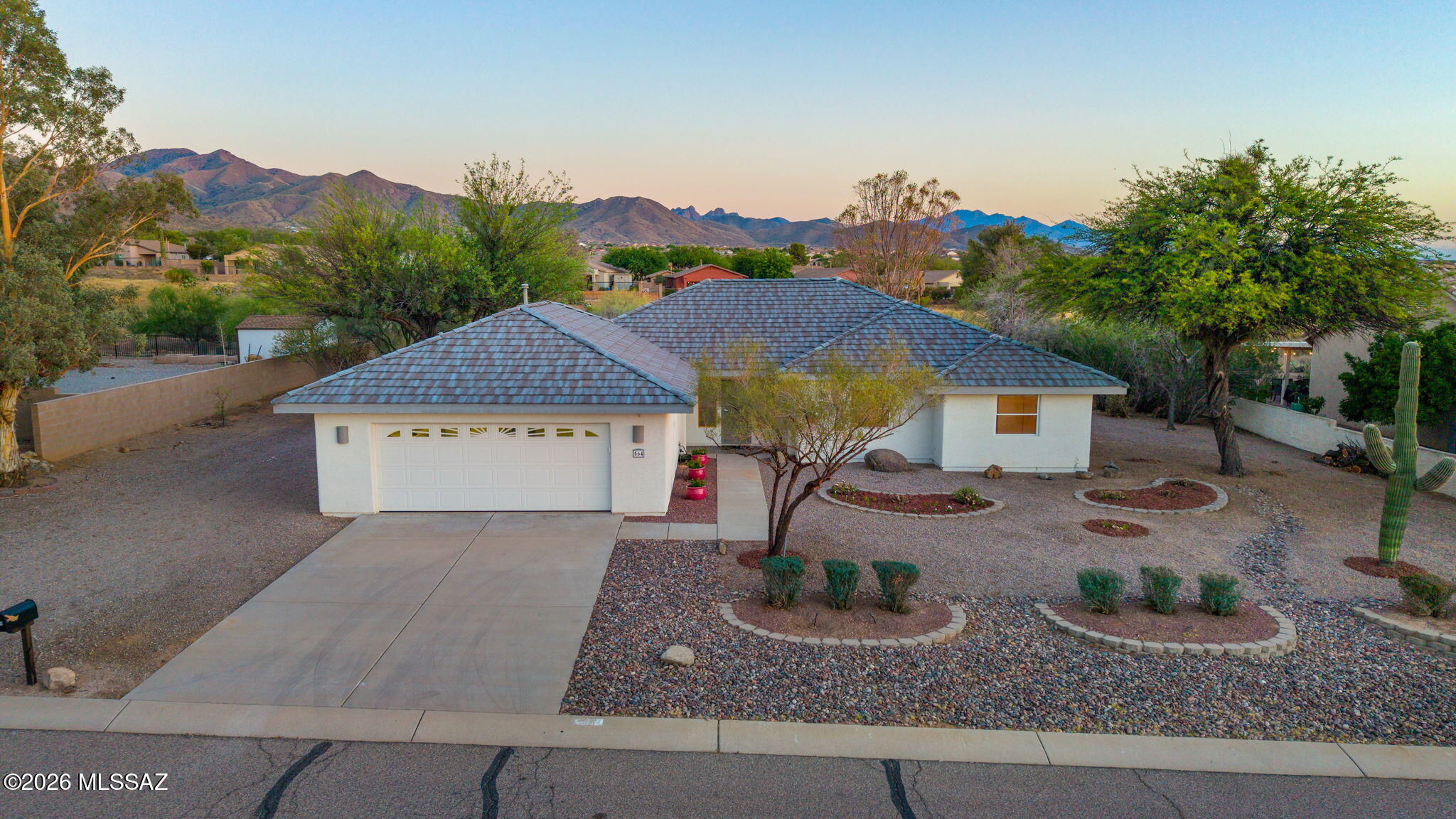 Exceptional home offering mountain views, wildlife, and privacy! Nestled on a premium .37 acre homesite backing up to natural desert. 2 bedrooms and den (designed for easy conversion to 3rd bedroom). The spacious living room offers a fireplace, coffered ceilings, and expansive windows that fill the space with natural light while framing  mountain and desert views. The kitchen offers abundant cabinetry, generous counter space, a breakfast bar, and seamlessly flows to dining area surrounded by windows  capturing panoramic views and providing direct access to the covered patio. There is a large walk-in pantry and a huge laundry and craft room with extensive built-in cabinetry, and workspace. The oversized primary suite provides space for a sitting area, exercise equipment, or media retreat. The expansive covered patio and extended paver terrace can be accessed from living room, primary suite and dining area making it perfect for indoor outdoor living, entertaining or relaxing while enjoying the spectacular mountain backdrop. An oversized garage offers ample room for vehicles, hobbies, and storage, completing this remarkable desert retreat.
Located in the Award Winning Vail School District.