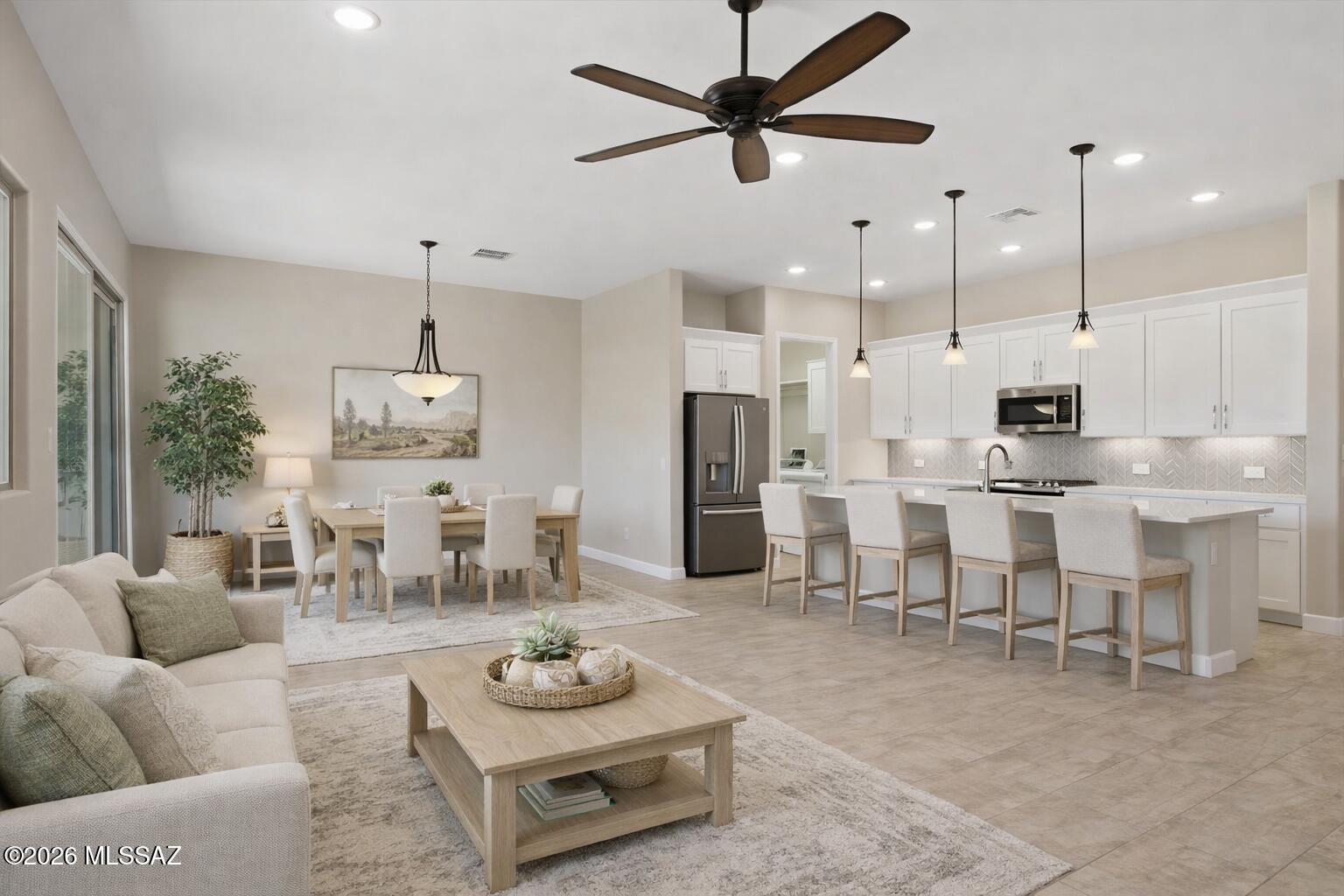Experience the resort lifestyle that makes SaddleBrooke one of Arizona's premier active adult communities. Built in 2019 and beautifully maintained, this move-in ready home offers the perfect lock-and-leave lifestyle, giving you more time to enjoy golf, pickleball, fitness centers, clubs, dining, and endless social activities. Inside, you'll find a bright open floor plan with 2 bedrooms, 2 baths, and a versatile den ideal for guests or a home office. The kitchen features quartz countertops, stainless steel appliances, a gas range, and large pantry. The spacious primary suite includes an oversized walk-in shower, while upgrades such as a water softener and epoxy-coated garage floor add convenience to everyday living.