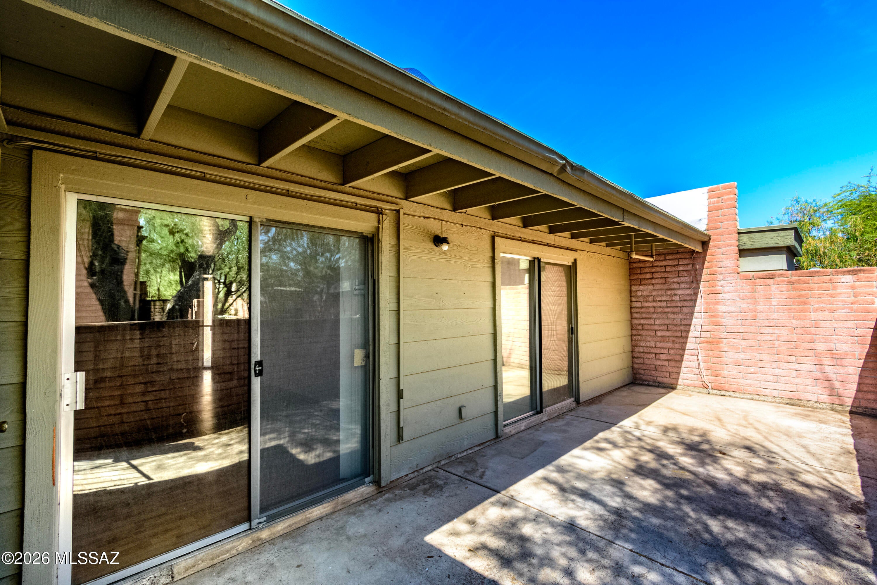 Easy Tucson living starts here! This single-level 2BR/2BA townhome offers an open, comfortable layout with fresh interior paint, new bedroom carpet and a newer HVAC system. Outside enjoy the covered patio, backed by common-area greenery--a great spot for morning coffee or relaxing at the end of the day. When it's time to cool off, head to the community pool, unwind in the spa. Covered carport parking adds everyday convenience, while the central location puts shopping, dining and daily essentials close at hand. Low-maintenance, comfortable and ready to enjoy!
