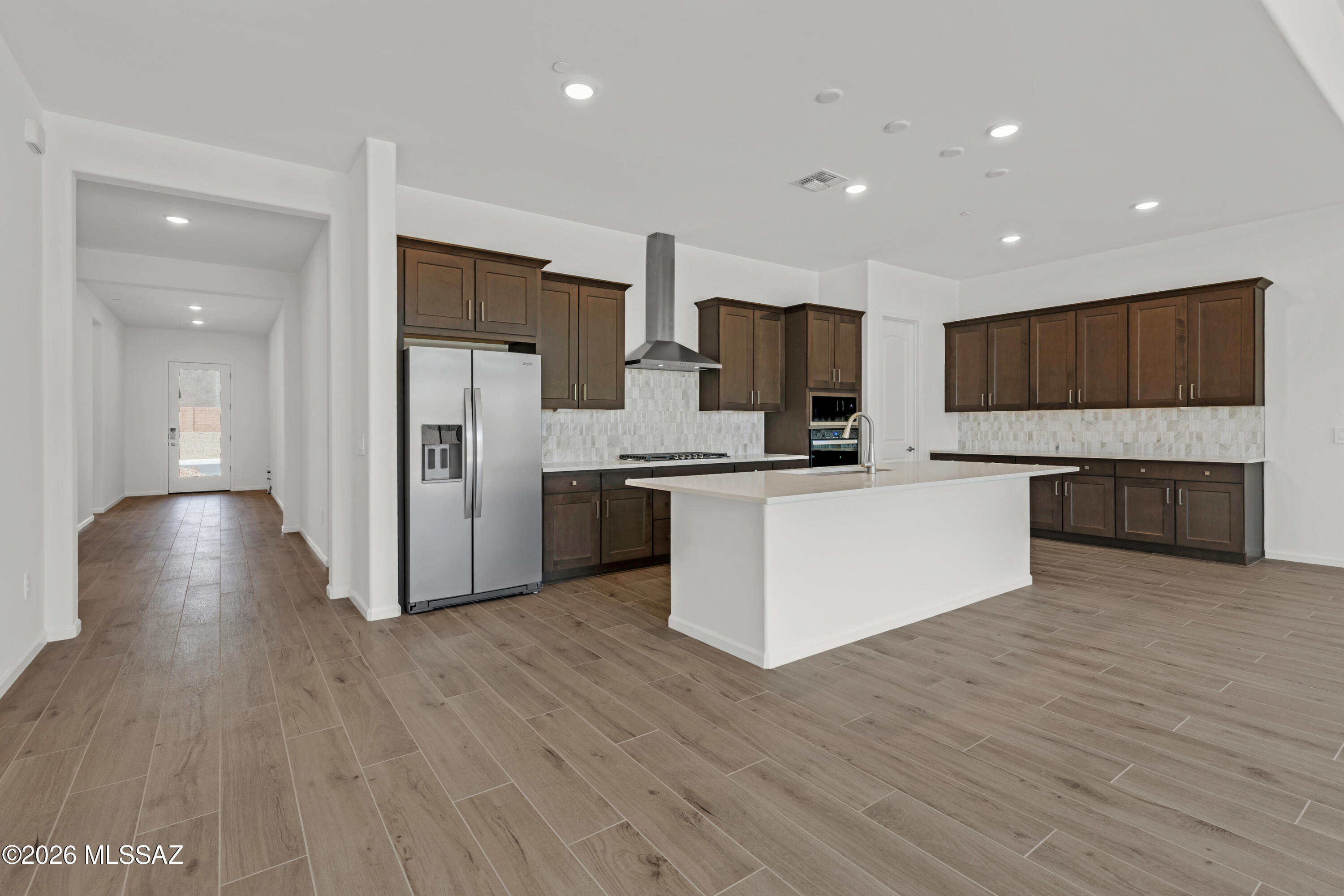 Oxford plan/Desert Modern elevation. This thoughtfully designed layout includes an open greatroom area with spacious kitchen & dining area. Convenient Stop-n-Drop area just in from the 4-car tandem garage for organization & a place to charge your devices. The Owner's suite is a retreat with a huge walk-in closet, a beautifully tiled walk-in shower, and dual vanities & linen closet. The modern Gourmet kitchen is equipped with a gas cooktop, refrigerator, center island and a walk-in corner pantry for all your culinary needs. Enclosed study provides extra room for studying, hobbies and more. Laundry room is complete with Washer/Dryer. Includes 2'' faux wood blinds.