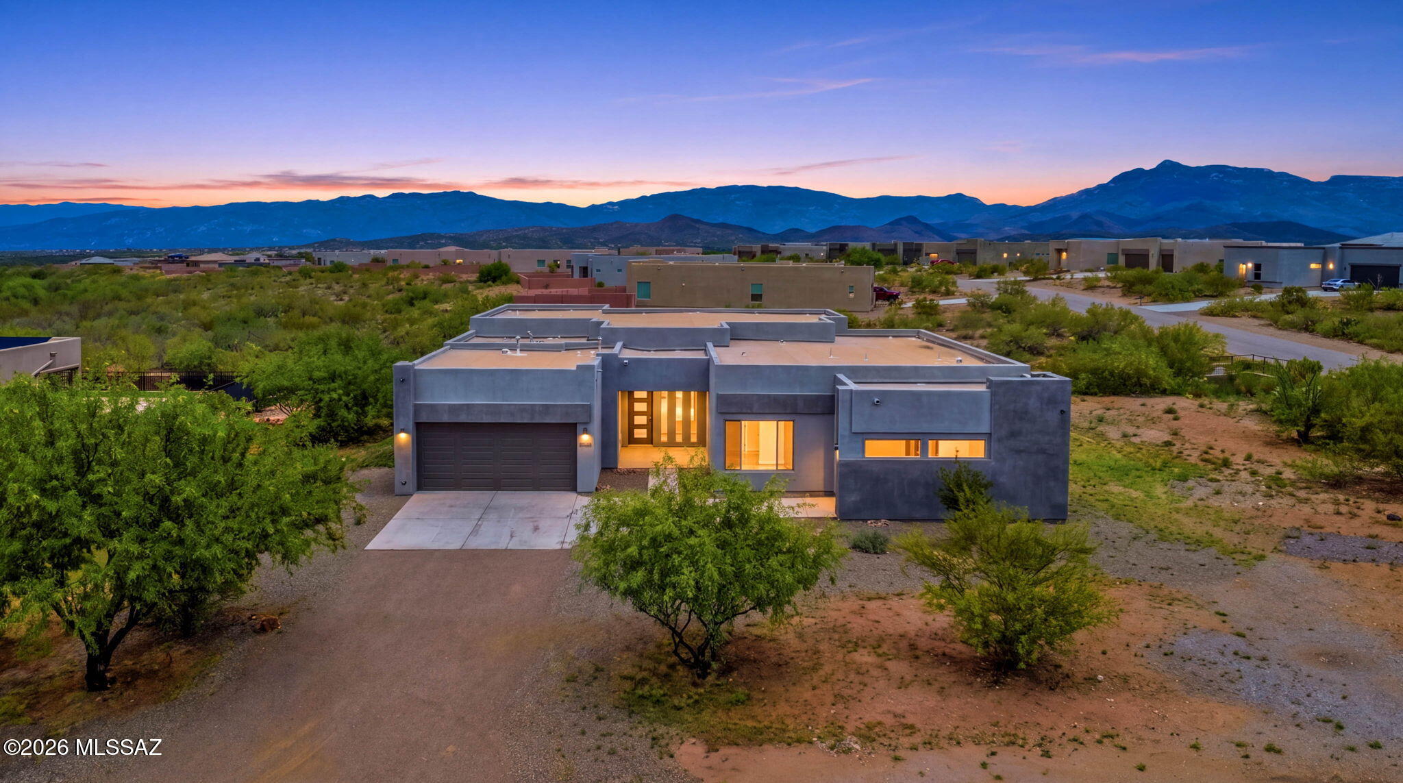 Assumable VA Loan 5.6% to eligible buyers! Luxury desert living meets exceptional design in this stunning Fairfield Homes Manzanita, built in 2022 and perfectly positioned on over one acre to capture breathtaking Rincon and Catalina Mountain views. Offering approximately 3,770 sq. ft., this thoughtfully designed single-story home blends privacy, sophistication and the indoor-outdoor lifestyle Southern Arizona is known for.
Soaring 12ft ceilings, dramatic 8 foot doors and luxury flooring create an immediate sense of scale, while an impressive 16' x 10' multi-slide glass door opens the great room to expansive desert and mountain views. The highly desirable split floor plan features 4 bedrooms, 3.5 bathrooms, a dedicated office and separate teen/flex room, providing exceptional versatility living.
The private primary suite is thoughtfully separated from the secondary bedrooms, while an additional bedroom offers its own en-suite bath, ideal for guests or multi-generational living. Two additional bedrooms share a convenient Jack-and-Jill bath, creating privacy and functionality throughout.
Outside, more than an acre provides the space and separation luxury buyers crave, complemented by spectacular views of the Rincon and Catalina Mountains and an incredible sense of privacy. A split 3-car garage adds functionality and storage, while spray-foam insulation and a tankless water heater enhance the home's energy-efficient design.
With newer 2022 construction, impressive architectural scale, flexible living spaces, acreage and unforgettable Arizona mountain views, this Manzanita offers a rare combination of refined luxury and peaceful desert living in Vail.