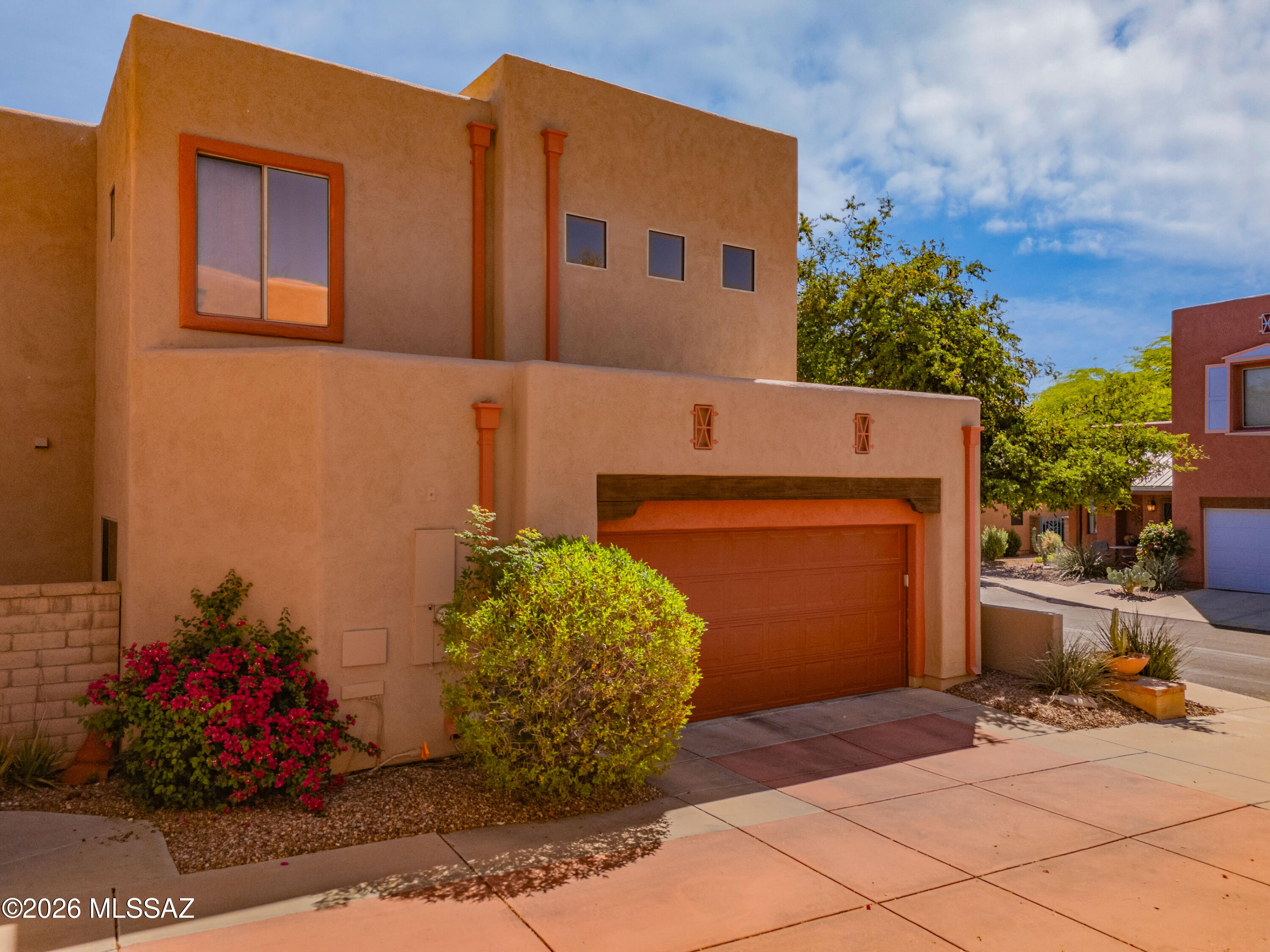 Welcome to this inviting home in the gated community of Presidio at Williams Centre, where the signature Colores design brings a warm Southwest feel with rich tones and unique character throughout the neighborhood. This thoughtfully designed 3 bedroom, 3 bathroom layout offers comfort and flexibility with multiple living areas including a welcoming front room and a spacious family room off the kitchen. A standout feature is the full bedroom and bathroom downstairs, ideal for guests or extended family. Upstairs, a versatile loft leads to a serene primary suite with an attached office, walk in closet, and spa inspired bath. Enjoy quiet mornings on the private patio or relax at the community pool, all just minutes from Tucson's best shopping and dining.