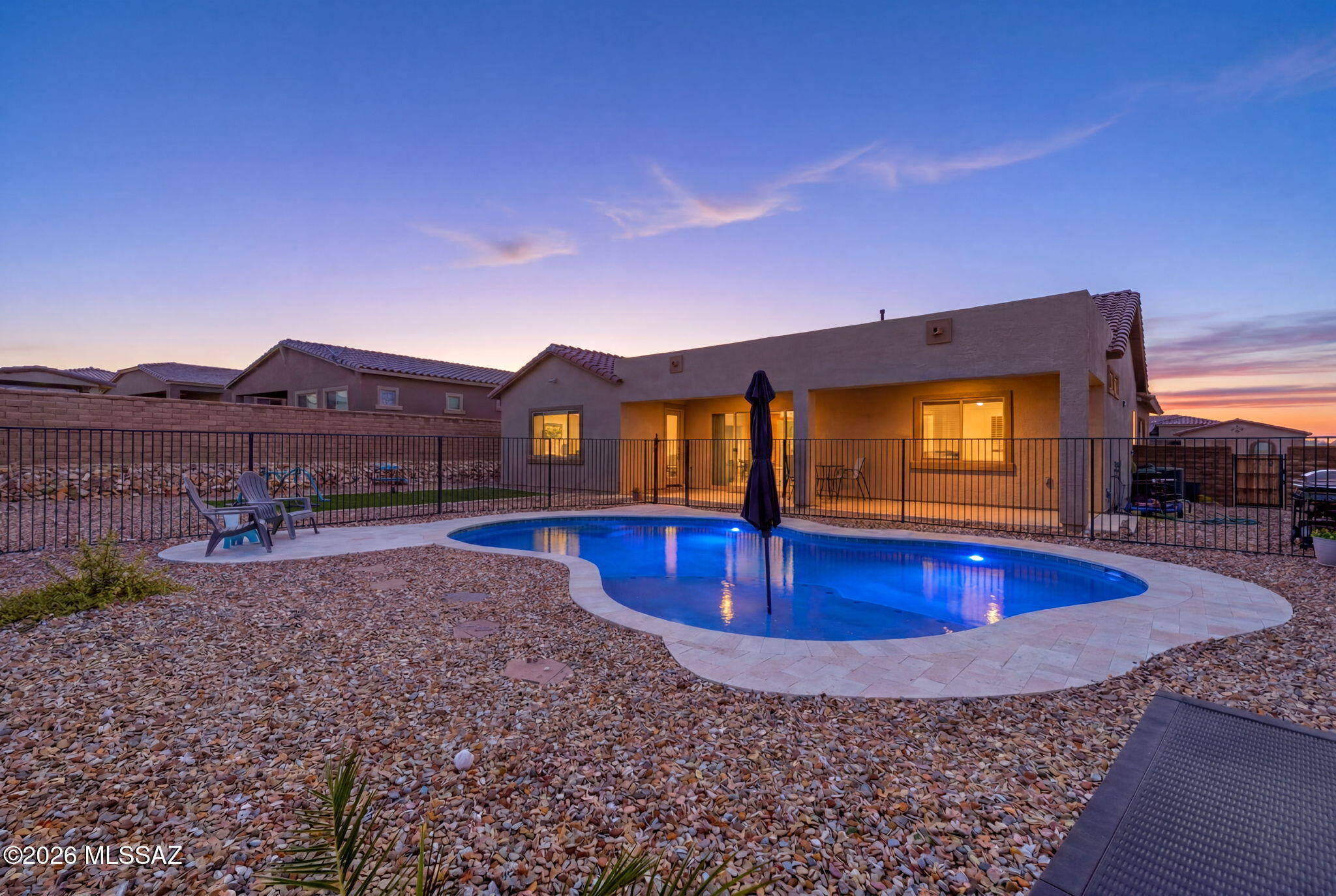 Motivated seller! There is a particular kind of evening that happens here, when the sun drops behind the Tortolita Mountains and the sky turns gold to rose to blue, while you are still in the pool. That is the evening this home was built for. This 2023 Lennar Catalina C sits on a premium 0.27 acre homesite in gated Los Saguaros at Dove Mountain, now with a brand new freeform pool and travertine decking as the showstopper. Inside, an open Great Room flows to a kitchen with granite counters, gas cooktop, and walk in pantry. Split floor plan, spa inspired owner's suite, dual walk in closets, flex den. Smart home features throughout. Gated community with clubhouse, park, and trails. Move in ready. Seller will cover 1 year of HOA dues! There is a particular kind of evening that happens in Dove Mountain, when the sun drops behind the Tortolita Mountains and the sky turns from gold to rose to deep blue, all while you are still in the pool. That is the evening this home was built for.

Set on a premium 0.27 acre homesite in the gated community of Los Saguaros at Dove Mountain, 6510 W Antler Bend Place has just added the one feature every buyer wants and few listings actually have: a brand new pool, freeform in shape with a soft pebble finish and travertine decking Throughout the backyard. A turfed side yard rounds out the space, giving kids or pets somewhere to run while the adults enjoy the view. An extended covered patio complete a backyard built for actual living, not just looking at.

Inside, the 2,598 square foot Catalina C floor plan by Lennar lives like new because it practically is, completed in 2024. An open Great Room connects to a kitchen built for real cooking and real gathering, with granite counters, a gas cooktop, stainless appliances, a walk in pantry, and a generous center island that overlooks the dining area and covered patio beyond. The split bedroom design places two secondary bedrooms and a flexible den away from the owner's suite, which offers a spa inspired bath with dual vanities and dual walk in closets, a true retreat at the end of the day.

Smart home touches come standard throughout: a Honeywell Z-Wave thermostat, smart front door lock, along with a tankless water heater for efficiency and comfort in every season.

Los Saguaros at Dove Mountain offers gated privacy, a community clubhouse, a park, and walking trails, all just minutes from Dove Mountain's golf courses and the growing shops and restaurants of Marana. This is move in ready living with the one upgrade that changes everything: your own resort just outside the back door.