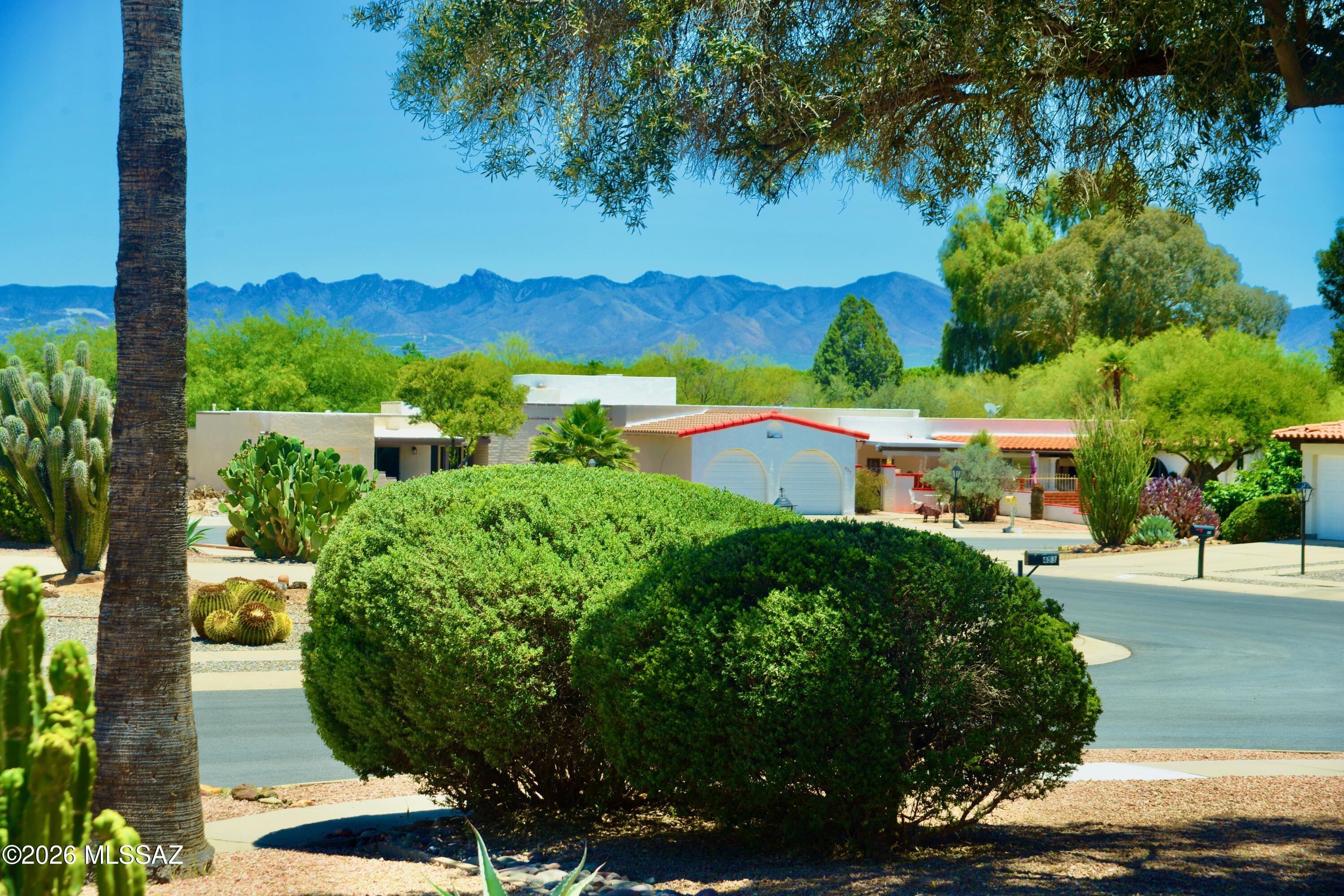 Quaint & charming 2 bed 2 bath home offers 1965 sq ft of inviting living space in a peaceful 55+ community. The welcoming front courtyard with mountain views sets the tone for the Southwest charm found throughout. Tucked back in a quiet cul-de-sac, this home offers privacy and comfort with room to spread out. An additional living room filled with natural light and walls of windows creates the perfect artist's retreat, entertaining space, or cozy gathering room. Bonus flex space off the primary bedroom is ideal for a home office, workout room, or private sitting area. Recent updates include a 2022 HVAC system, 2022 roof recoat tankless water heater, upgraded electric panel! Conveniently located near shopping, GVR centers, dining, shopping and highway.