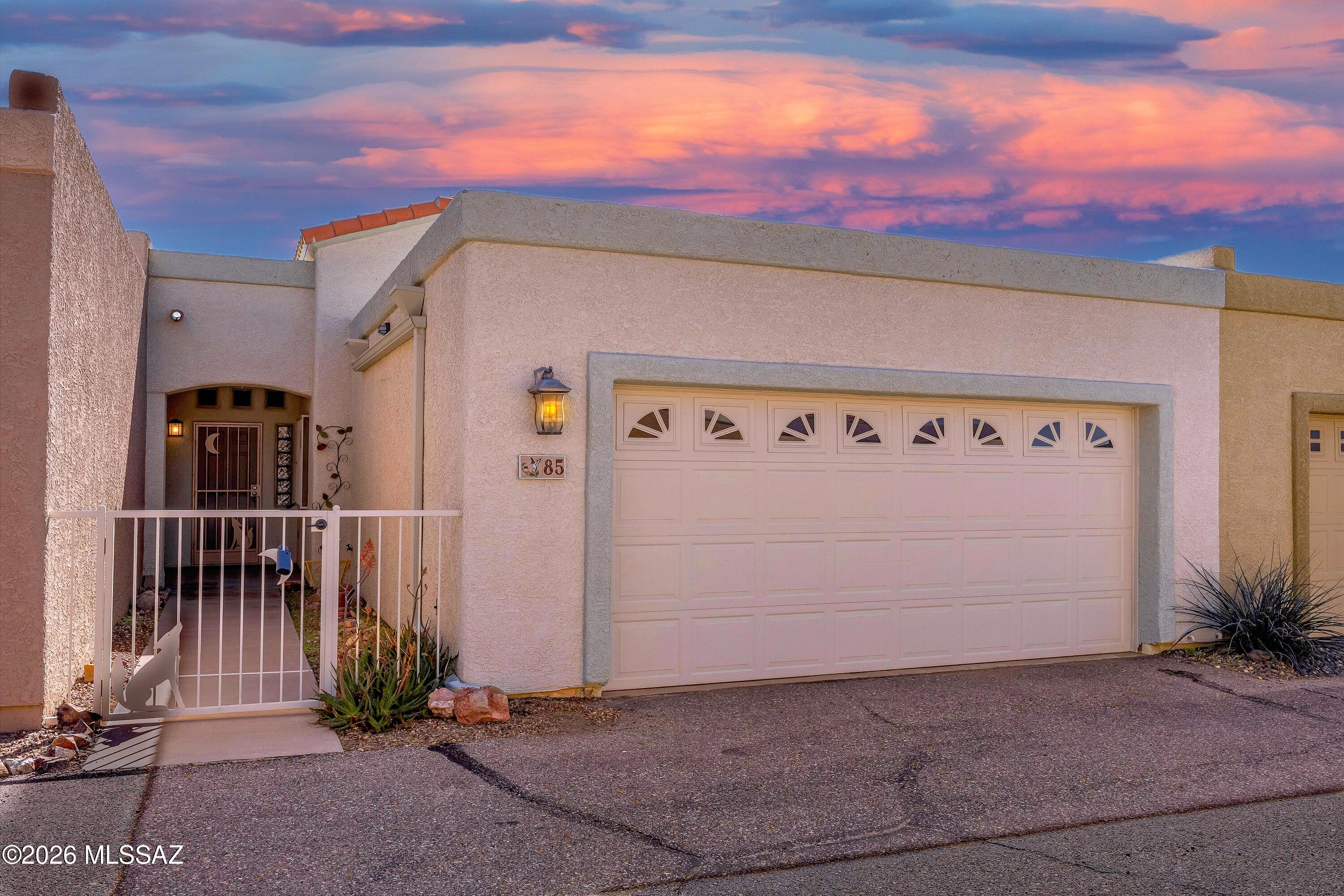 Wonderful move-in ready Eastside townhome! NEW carpet & interior paint. Two spacious bedrooms both with walk-in closets + Den/Office. Kitchen cabinets offer pull out shelves. Loads of storage throughout including the laundry room and over-sized garage! All appliances convey! Screened in back patio. Newer Water heater. Quality construction with 2x6 framed exterior. Community pool is only steps away! HOA dues include water/sewer/trash, streets/parking area, community pool & grounds. Convenient location to shopping, restaurants & more!