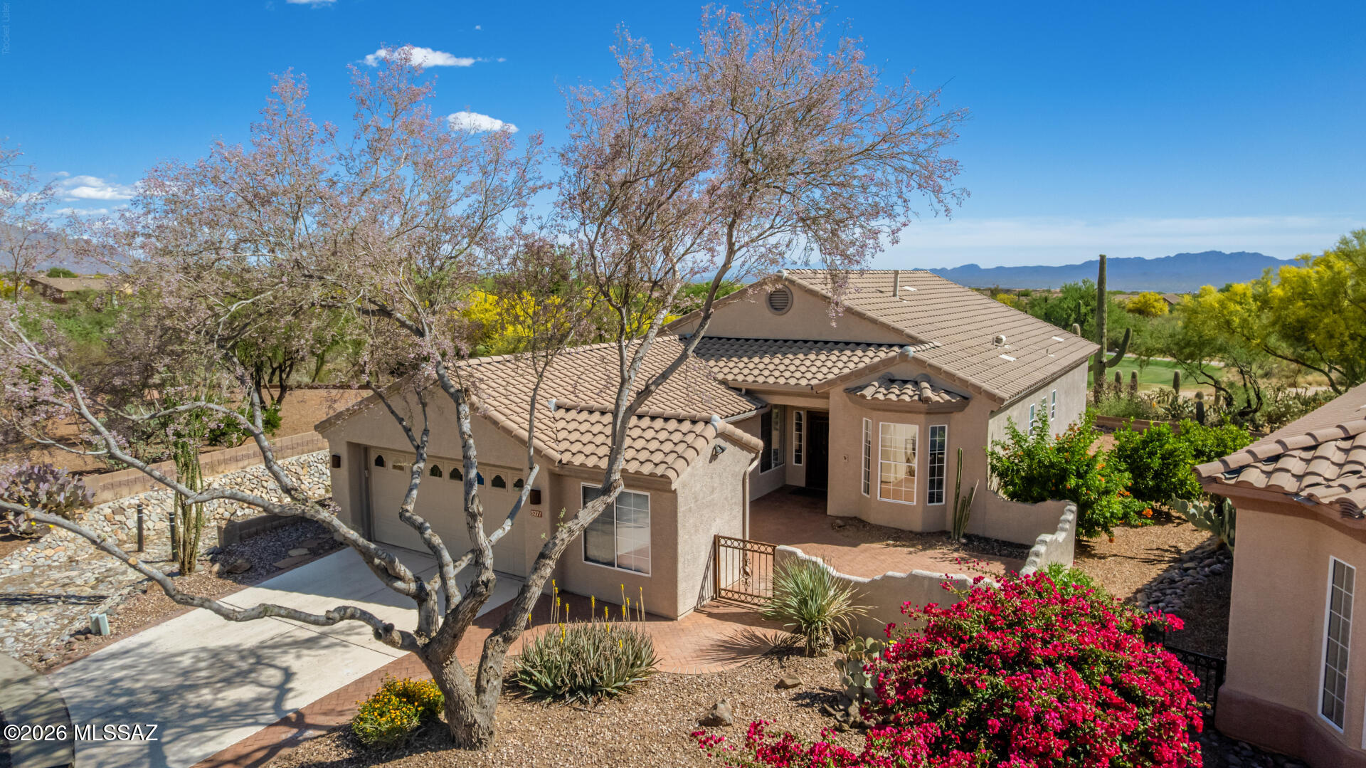 Welcome to this beautifully upgraded Extended Hillsboro on a quiet cul-de-sac, ideally located near the 7th  Green with stunning Mountain, Desert, and Golf Course views! This 3-bedroom, 2-bath home features a large paver courtyard, 2-car garage plus golf cart parking and a remodeled kitchen with granite countertops, stainless steel appliances, large pantry, and pendant lighting. The primary bedroom takes in gorgeous views with a bay window, organized walk-in closet, and remodeled bath. The second bedroom also has a bay window and access to the hall bath. The extended third bedroom- formerly the den- features a large closet and solar tube, making it perfect as a bedroom, office, or den. An extended laundry room includes a desk and utility sink, and a large slider opens to a covered flagstone patio with a built in gas BBQ where you'll enjoy breathtaking views and the most spectacular sunsets on of Dove Mountain. A natural wash on one side and desert buffer behind offer wonderful privacy. The Highlands is a resort-style active adult community offering 24 hour manned security,  an award winning golf course, pickleball, tennis, pool and spa, fitness center, and a vibrant clubhouse with restaurant and bar. With an incredible lineup of clubs, social events, and activities there is something for everyone here. Views. Privacy. Location. Upgrades. This one is special -- don't miss it! Close to Hiking and Biking trails.