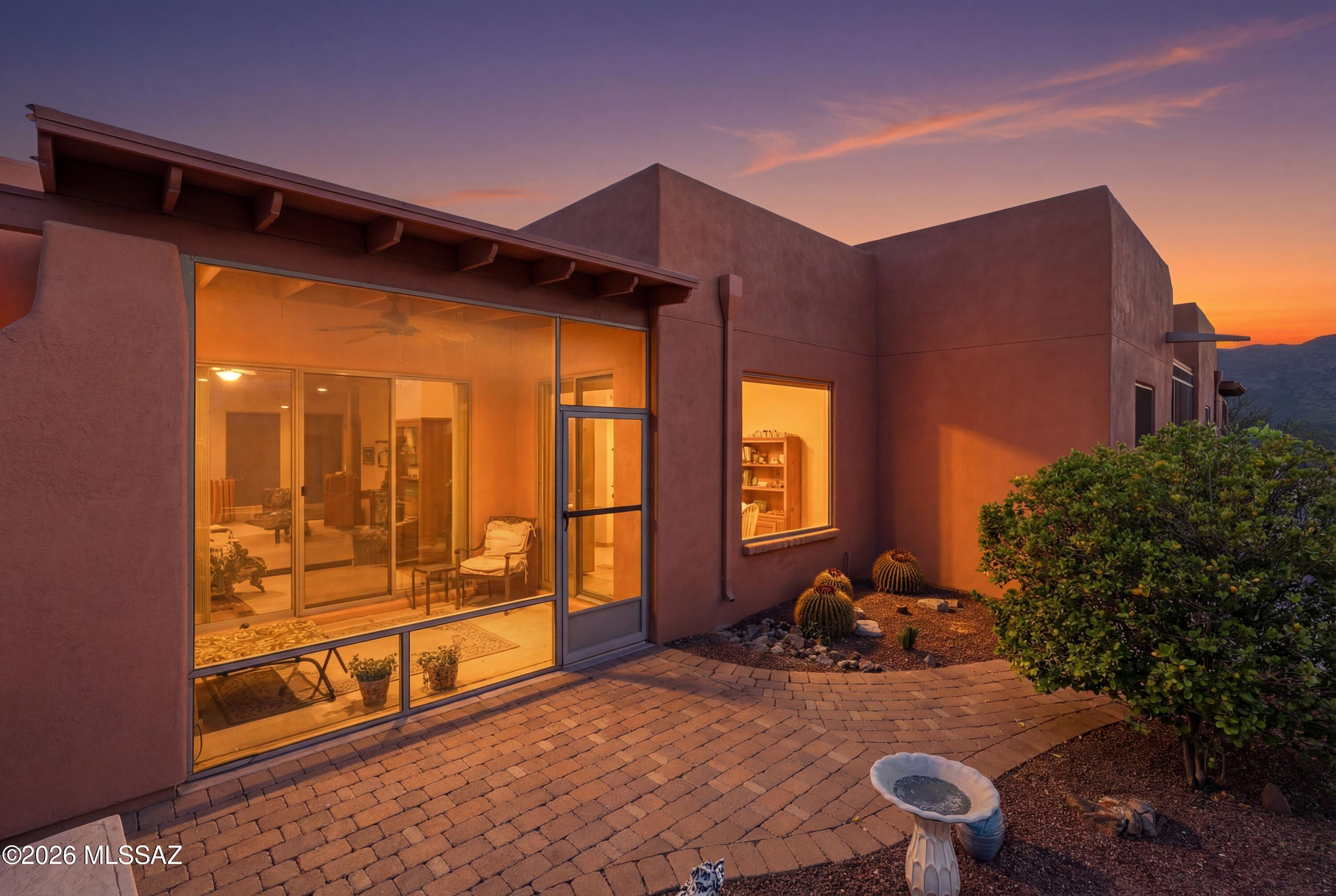 Be a Lifelong Learner at Academy Village! This desirable age restricted community not only boasts a beautiful community center, fitness facility, sparkling pool, tennis and pickleball courts, dog park, and lots of walking paths, but also offers classes, events, lectures, and so much more! This rare corner unit has OWNED SOLAR and is a highly sought after floor plan - with a beautiful kitchen, two generously sized bedrooms, a versatile office/den, wide doorways and hallways for easy wheelchair accessibility - it has it all. Enjoy the beautiful desert landscape from your screened patio / catio. Relax inside and enjoy absolutely zero road noise - just peace and quiet. Create everlasting memories, it's easy to do here. This one won't last long. For more information, visit academyvillagehoa.org