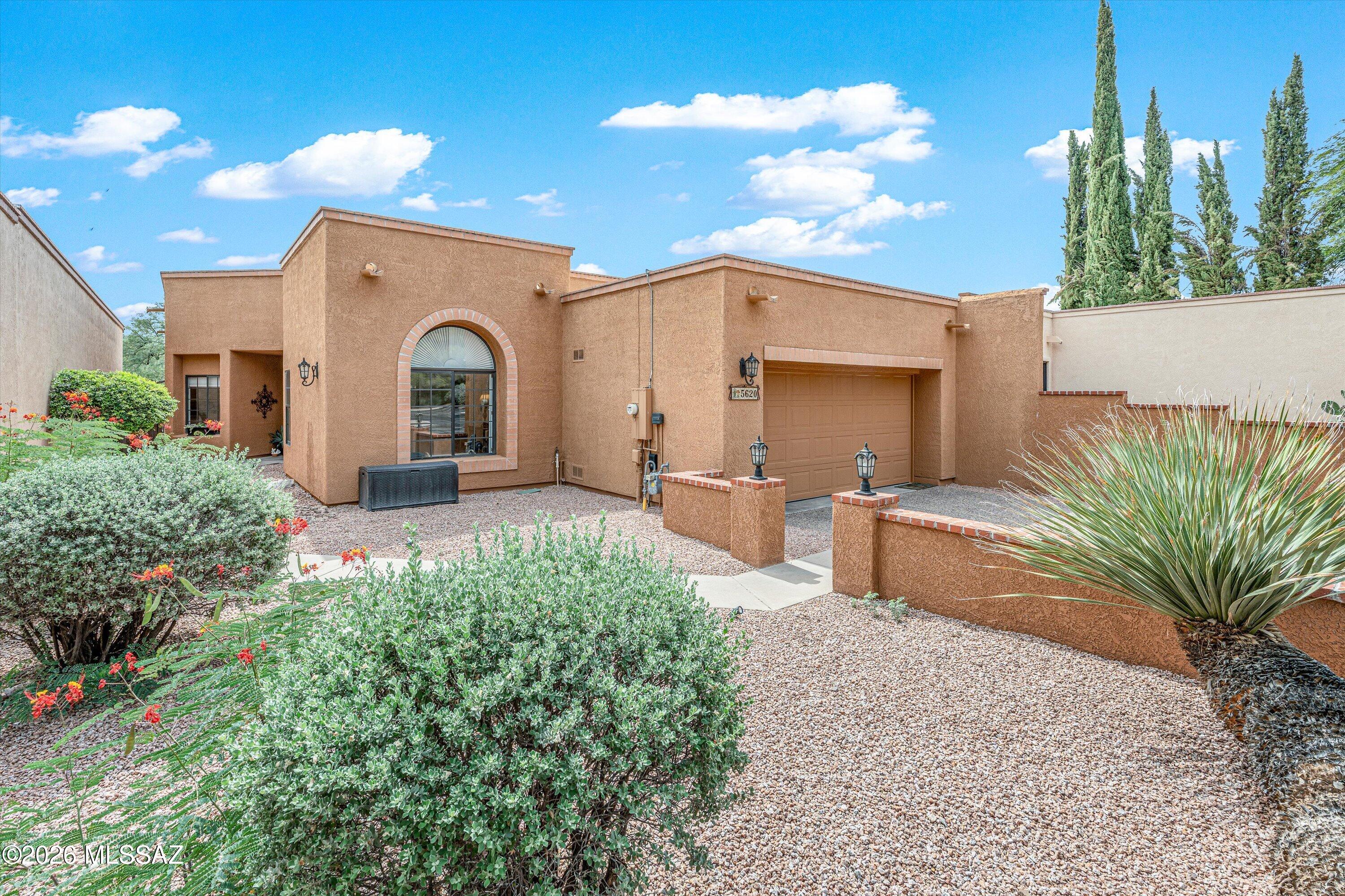 Beautiful, Gated San Miguel community offers, charm, tranquility, privacy and superb location. This spacious townhome flows well and offers warm, light-filled space with nicely updated kitchen & baths, high ceilings, large windows, skylights, large-format tile flooring throughout & gas fireplace. Lovely backyard is peaceful with a pretty fountain and big, fabulous fruit tree that provides excellent shade. Property has been very well-maintained, features new exterior paint, new garage door, new superior roofing material, new dishwasher, ''smart'' one piece full-size washer/dryer and a safe, shaded outdoor pet area.  Community pool, tennis/pickleball, beautiful common areas.  Classic look and lines, understated elegance and spirit , easy living at its best!