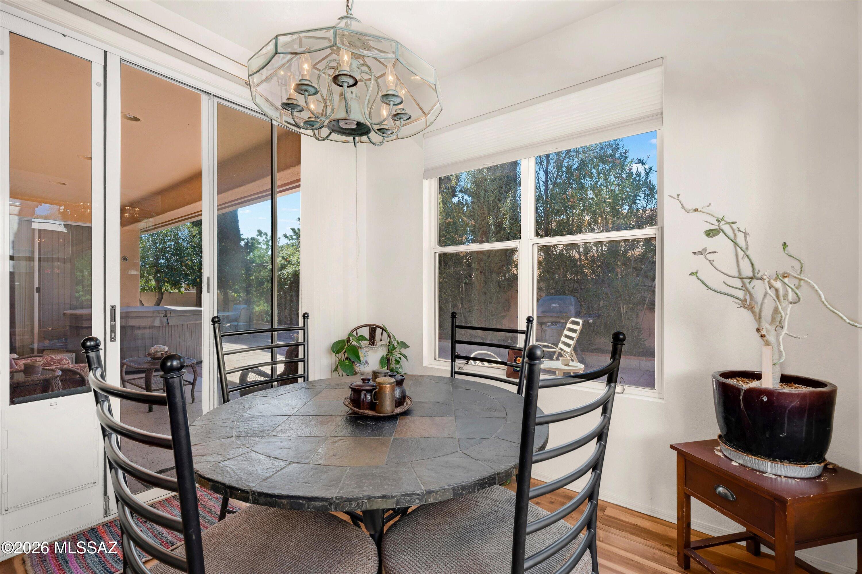 Welcome to this charming single-story home nestled in the desirable North Ranch community in Northwest Tucson. Featuring an open and functional split floor plan with high ceilings and an abundant of natural light. This home offers comfortable everyday living with timeless appeal. The spacious kitchen flows into the main living areas, creating a welcoming space for both relaxing and entertaining. The primary suite includes a walk-in closet and private bath, while additional bedrooms offer flexibility for guests, home office, or hobbies. Enjoy low maintenance desert landscaping in a private backyard with a covered patio- perfect for outdoor living. Located on a quiet cut-de-sac and close to community amenities including pools, tennis courts, walking paths and parks.