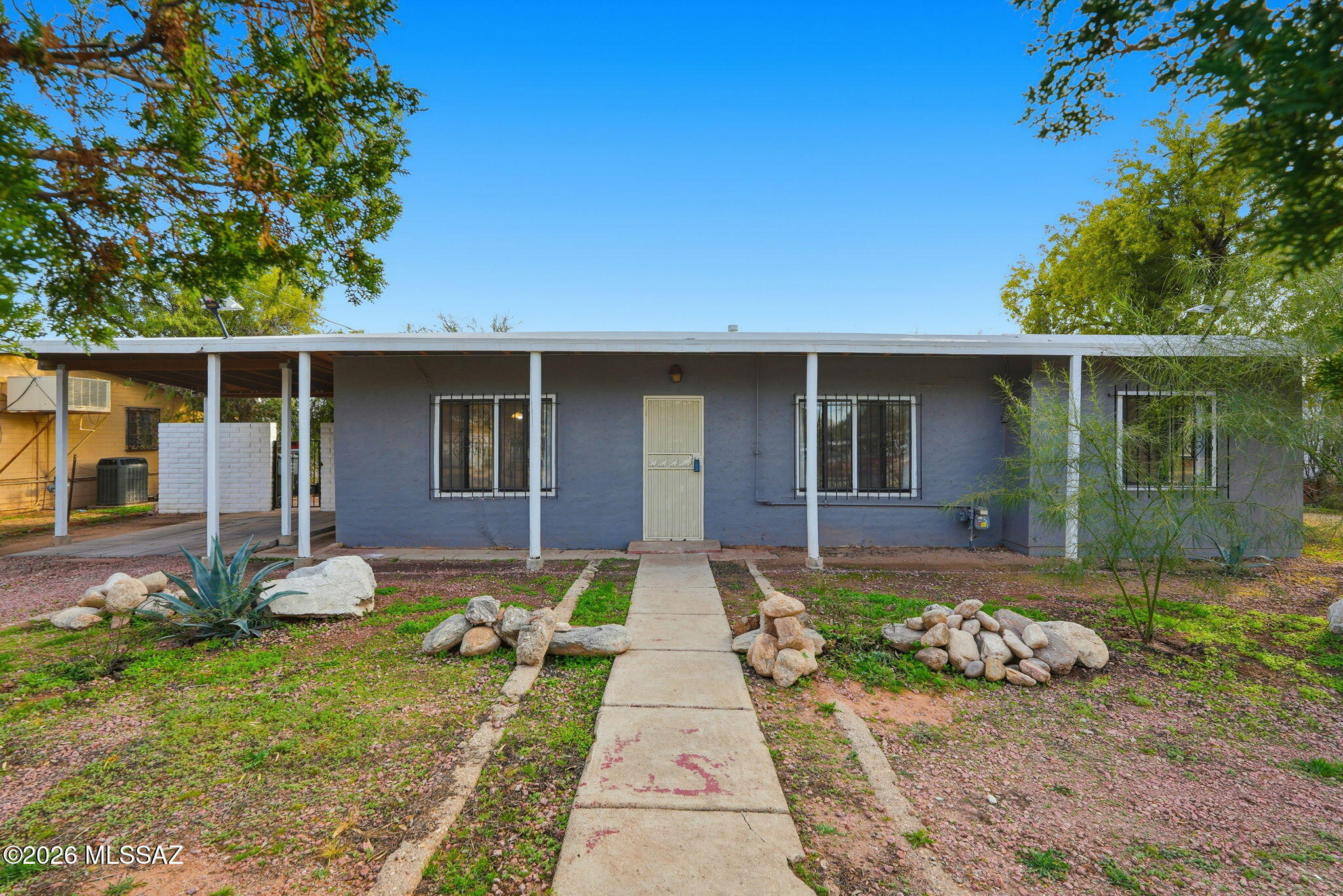 This home is located in a convenient central area on a generous 0.36-acre lot. The property is zoned R2, offering significant potential for expansion or the construction of a second dwelling. Please note that although a second dwelling was previously approved in 2021, the permit must be resubmitted. You can find the proposed plans attached in the documents section.
The existing residence features: 3 Bedrooms and 1.5 Baths, Tile flooring throughout, Mini-split cooling/heating systems, and an attached carport.
The property is ideally located near TMC, the University of Arizona, Crossroads Festival, Williams Circle, and various shops and restaurants.