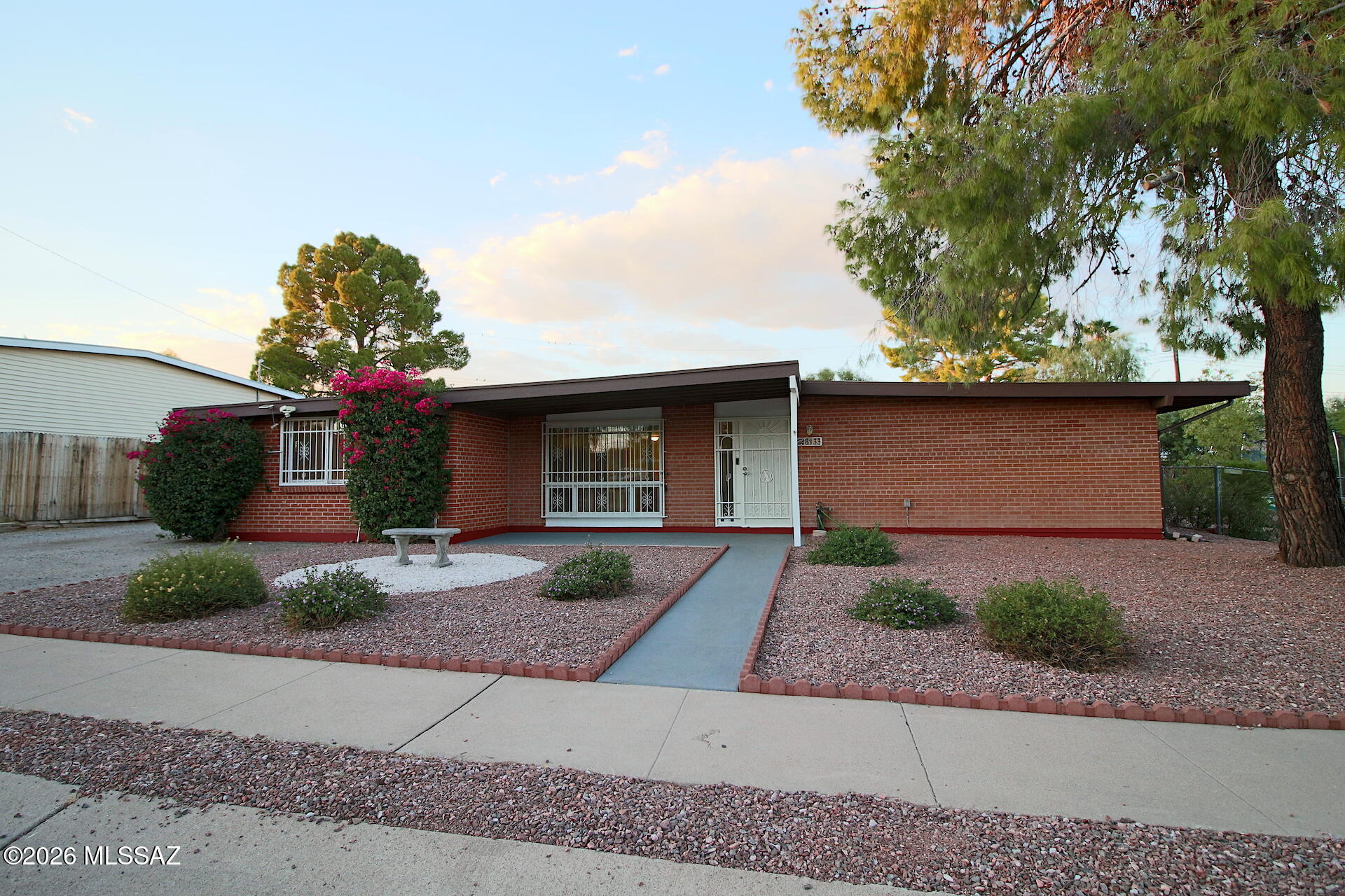 Stunning 5-Bedroom Tucson Home | Move-In Ready with Space, Style & Upgrades

Welcome to this beautifully refreshed 5-bedroom, 2-bath home offering 2,352 sq. ft.  of thoughtfully updated living space on a versatile .19-acre lot in a highly desirable east-side neighborhood. Blending modern upgrades with everyday comfort, this home is ideal for growing households, multi-generational living, or anyone needing flexible space.

Inviting interior features brand-new engineered wood flooring, fresh new carpet, and a full repaint that creates a clean, contemporary feel. Enjoy peace of mind with new HVAC systems, upgraded electrical panel, and ceiling fans throughout--keeping you comfortable year-round.

Modern kitchen with granite countertops and included appliances, ready for everyday living entertaining. Updated primary bathroom with a spa-like shower. Flexible 5th bedroom ideal for a home office, playroom, study zone, or private in-law suite. Spacious yet cozy family room with wood-burning fireplace--perfect for relaxing or movie nights. The enclosed Arizona room expands your living space and provides the perfect setting for enjoying indoor-outdoor living year-round.

Outdoors, the expansive yard offers room for RVs, ATVs, and all your toys, plus a new canopy carport, multiple sheds, and abundant storage for hobbies and gear. With five dedicated parking spaces and no HOA, you'll enjoy both freedom and functionality.

Conveniently located near schools, shopping, dining, and everyday essentials, this home delivers the perfect combination of space, upgrades, and value--just waiting for your personal touch. Don't miss your opportunity to make it yours!