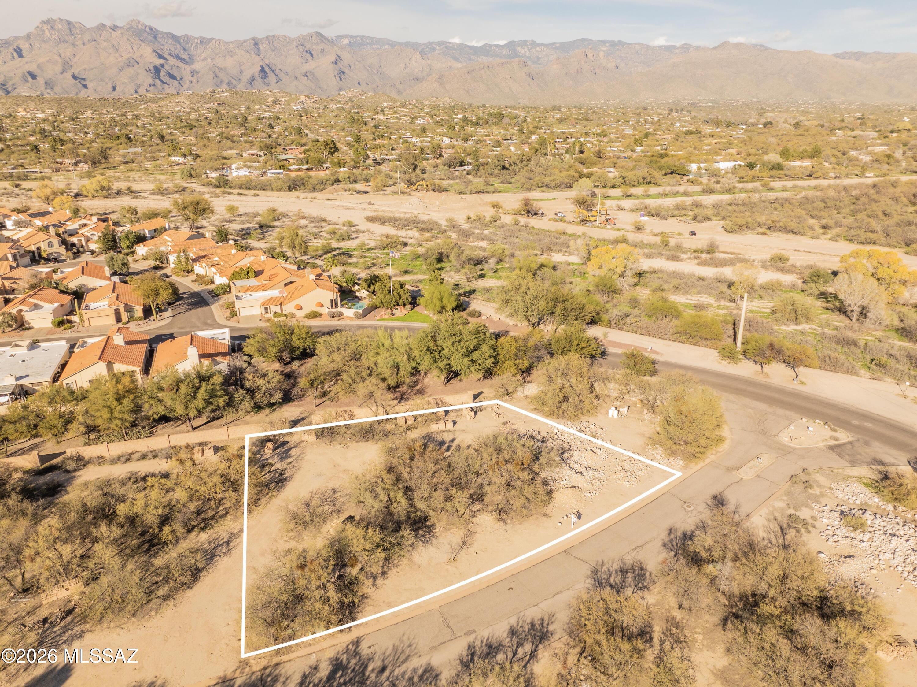 Bring your builder!  Hard to find flat lot with mountain views just off of River Walk on the Pantano Wash  in small subdivision of 20 lots in North East Tucson. Just North of Tanque Verde off Pantano Road this small community is a hidden gem.  First lot on the north side of the entrance.  Low to medium density zoning. 
Less than 2 miles to Udall Park and Recreation Center where you can take classes, swim, play pickleball, walk, enjoy the Friday farmers market, splash pad and more!  Grocery, Walgreens, dining, all with in 2 miles!