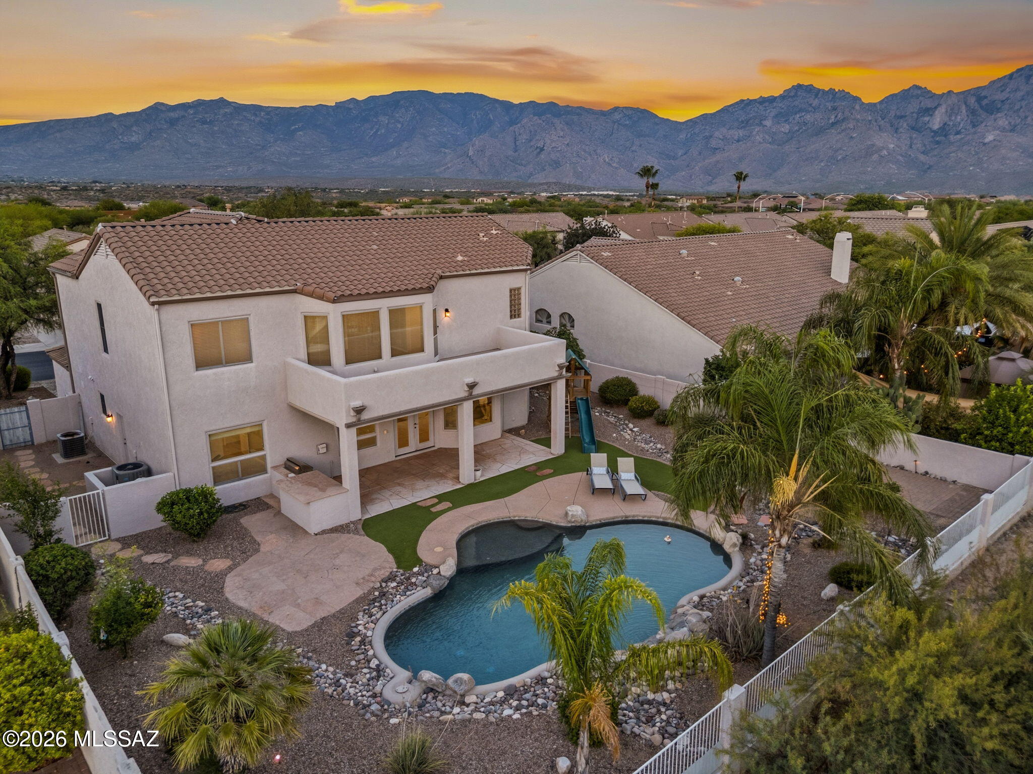 Prepare to fall in love with this stunning home, perfectly situated on a private lot backing to common area w/ mountain views. Featuring a rare 3-car garage, 5 BR, 3 full BA. The first-floor BR and full BA provide added convenience and versatility. Soaring ceilings & updated kitchen showcases custom cabinetry, granite countertops & stainless double ovens. Move-in ready with fresh interior & exterior paint, new upstairs carpet, ceramic tile throughout the main floor, newer windows, and a new roof! Owner's suite opens to a private balcony & features a spa-inspired bath with soaking tub and tiled walk-in shower. The backyard is made for entertaining with a Pebble Tec pool, fire pit area, built in BBQ, play castle, flagstone patio, turf, & mature fruit trees.