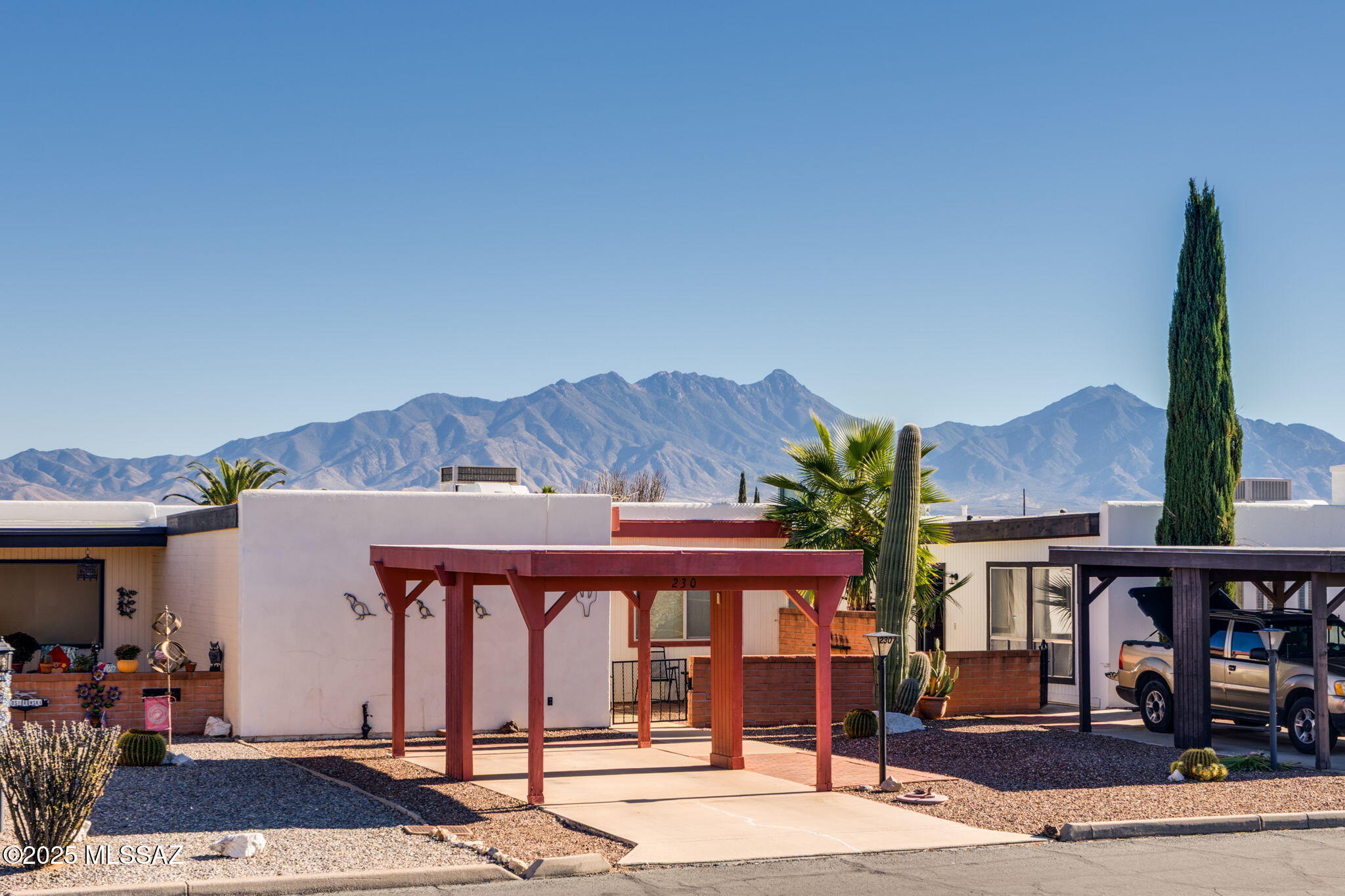 FULLY FURNISHED and NEWLY COATED ROOF, this home is move-in ready.  A rare 2BD+office/2BA configuration, this home offers sweeping views of the Santa Rita Mountains and a quiet, central Green Valley location.  An enclosed Arizona room brings the square footage to a whopping 1,480 SF.  The great room flows into an inviting kitchen right beside a wet bar, while skylights add natural light throughout. The oversized third bedroom spans the width of the home--perfect for a primary bedroom, guests, hobbies, or a studio. Enjoy a west-facing patio, low-maintenance landscaping, and a spacious workshop/mancave. Just minutes to restaurants, groceries, and I-19. This home is in an age-restricted Active Adult community and a deeded part of Green Valley Recreation.