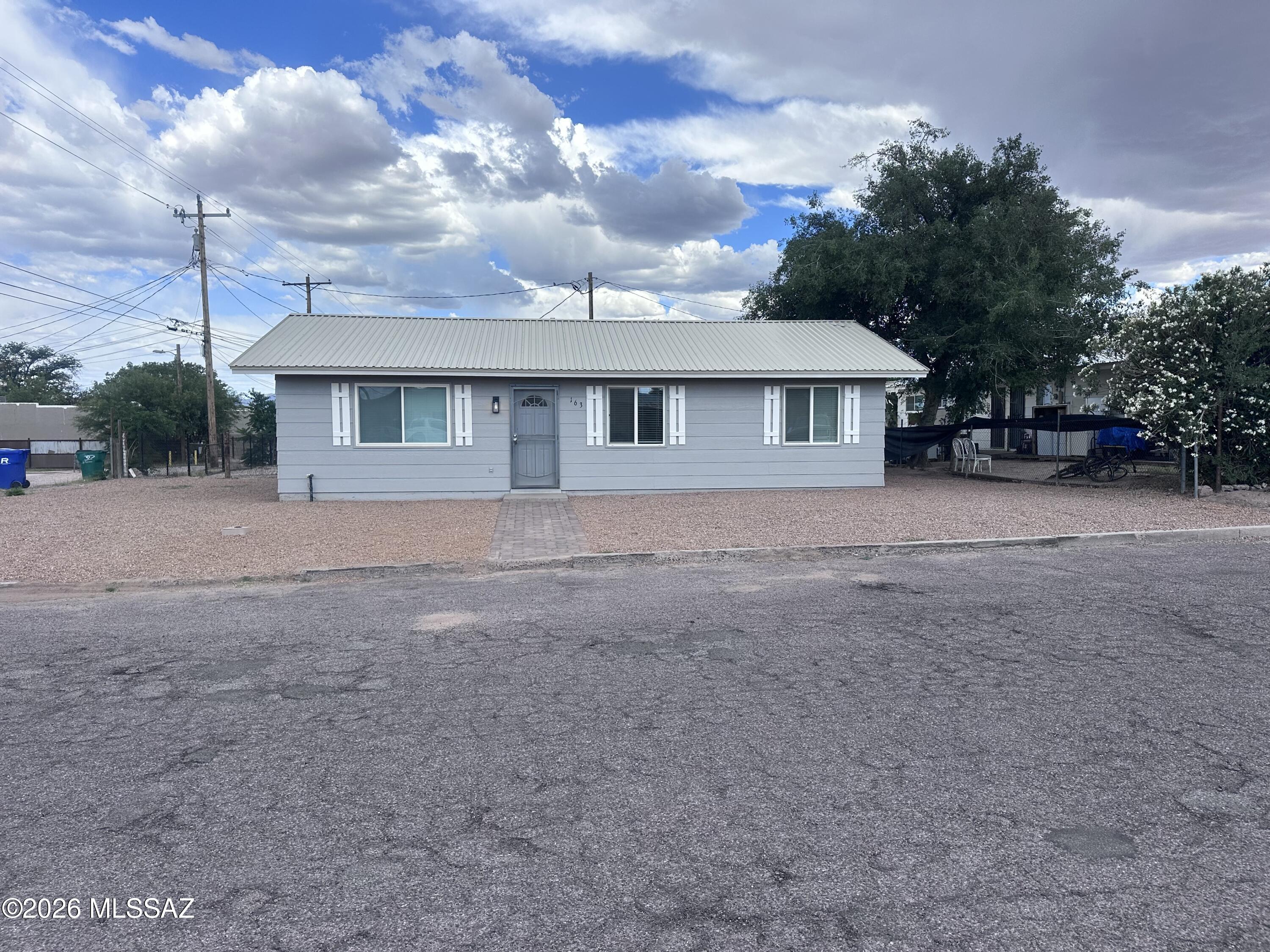 Located in the heart of Benson, this beautifully updated 3-bedroom, 1-bath home offers 1,161 square feet of comfortable living space with a convenient in-town location. Just moments from 4th Street, you'll enjoy easy access to shopping, dining, schools, and everyday amenities. Recent improvements include attractive laminate flooring, a remodeled kitchen, and an updated bathroom, blending modern touches with cozy charm. Outside, newly added decorative gravel enhances the curb appeal and creates a low-maintenance landscape. Whether you're searching for a primary residence, investment property, or affordable move-in-ready home, this Benson gem is one you won't want to miss!