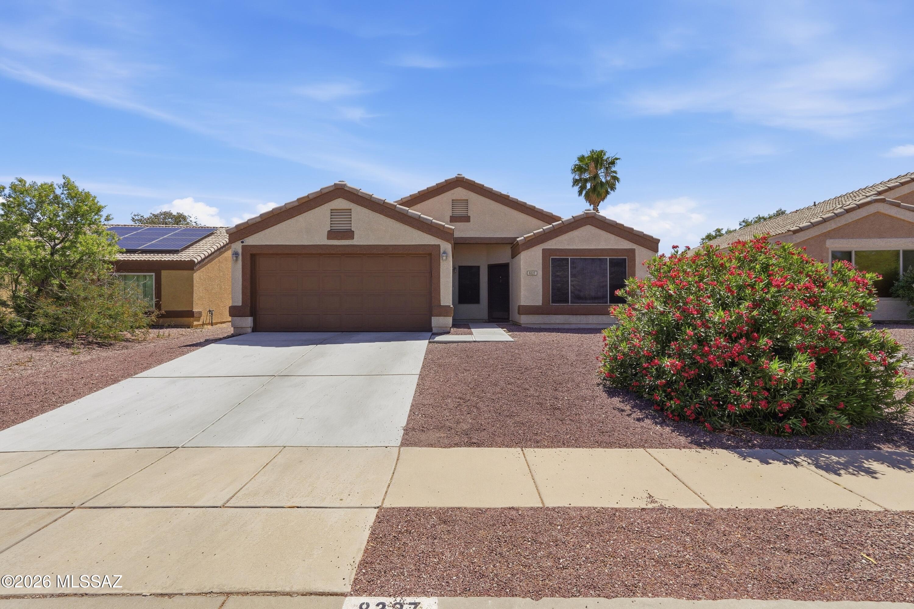 High Vaulted Ceilings.  Newer AC, Rita Ranch in Vail School District.  Conveniently located - to Frys, Near shopping, parks and schools.  Roomy easy-care yard with covered patio.  Spacious 2 car garage.  All solid wood flooring throughout.  Costco to open soon.