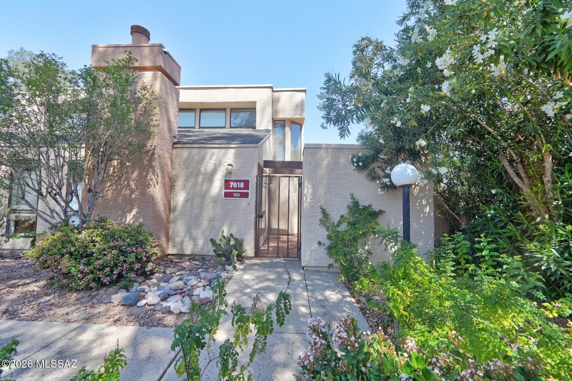 MARKET READY FOR QUICK & PROMPT SALE!!  Immaculate  & Beautifully maintained end unit home in Coronado Place.  Brand New Frigidaire Wash & Dryer Installed. Light & Bright Loft Style Condo has 2 Bed/2 Baths with High Ceilings.  Warm Alderwood Kitchen Cabinetry has Pull-Out Shelves, Lazy Susan, Pantry and Eat-Up Breakfast Bar.  All appliances Convey. Newer AC installed in 2023.  Fireplace in Greatroom.  Walk-in Closet in 2nd Bedroom with Full Ensuite Bath.  Private Patio features Saltillo Tile and a Spacious Storage Closet.   HOA Covers Outside Paint, Roof Roads, Water & Sewer and Trash.  Convenient Covered Parking just Steps Away from the Home.  Extra Parking Close.  Close to Restaurants, Shopping and Park