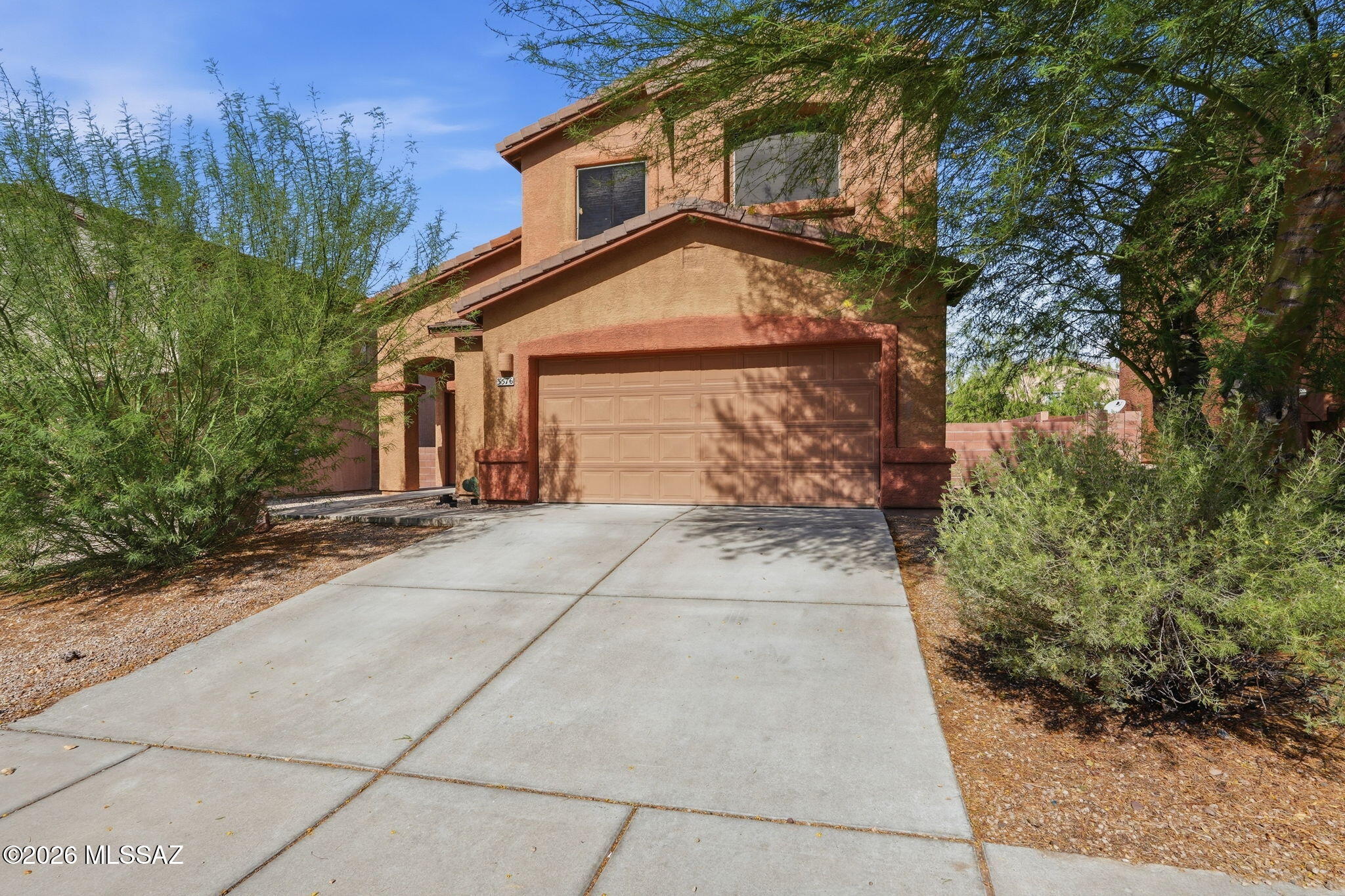 No Application Fees! Spacious 4-bedroom, 2.5-bathroom North Tucson home located in the desirable Cortaro Crossing community. This open floor plan home features wood laminate and tile flooring throughout the first floor with neutral carpeting upstairs, two-tone neutral paint, ceiling fans in each room, upgraded 2-inch window blinds, and abundant natural lighting. The spacious living room offers direct backyard access and flows into the beautifully updated kitchen featuring upgraded cabinetry, center island with breakfast bar, tile backsplash, separate pantry, stainless steel appliances, and ample cabinet and counter space. All four bedrooms are located on the second floor, including the oversized primary suite featuring vaulted ceilings, a large walk-in closet, dual sink vanity, and spacious step-in shower. The attached two-car garage offers ample parking and storage along with built-in storage cabinets. Easy-to-maintain desert landscaping surrounds the home, while the backyard features an extended covered patio with tile flooring providing a comfortable outdoor living space.

Cortaro Crossing offers a convenient Northwest Tucson location close to neighborhood parks, shopping, restaurants, schools, golf courses, and outdoor recreation. Enjoy easy access to I-10, Tucson Premium Outlets, Northwest Medical Center, Marana, and the growing Northwest Tucson employment corridor.

All Denali Real Estate residents are automatically enrolled in the Resident Benefits Package (RBP) for $55.00/month which includes Renter's Liability Insurance, Credit Building to help boost the resident's credit scores with timely rent payments, up to $1M Identity Theft Protection, HVAC air filter delivery (for applicable properties), our best-in-class resident rewards program, and much more!