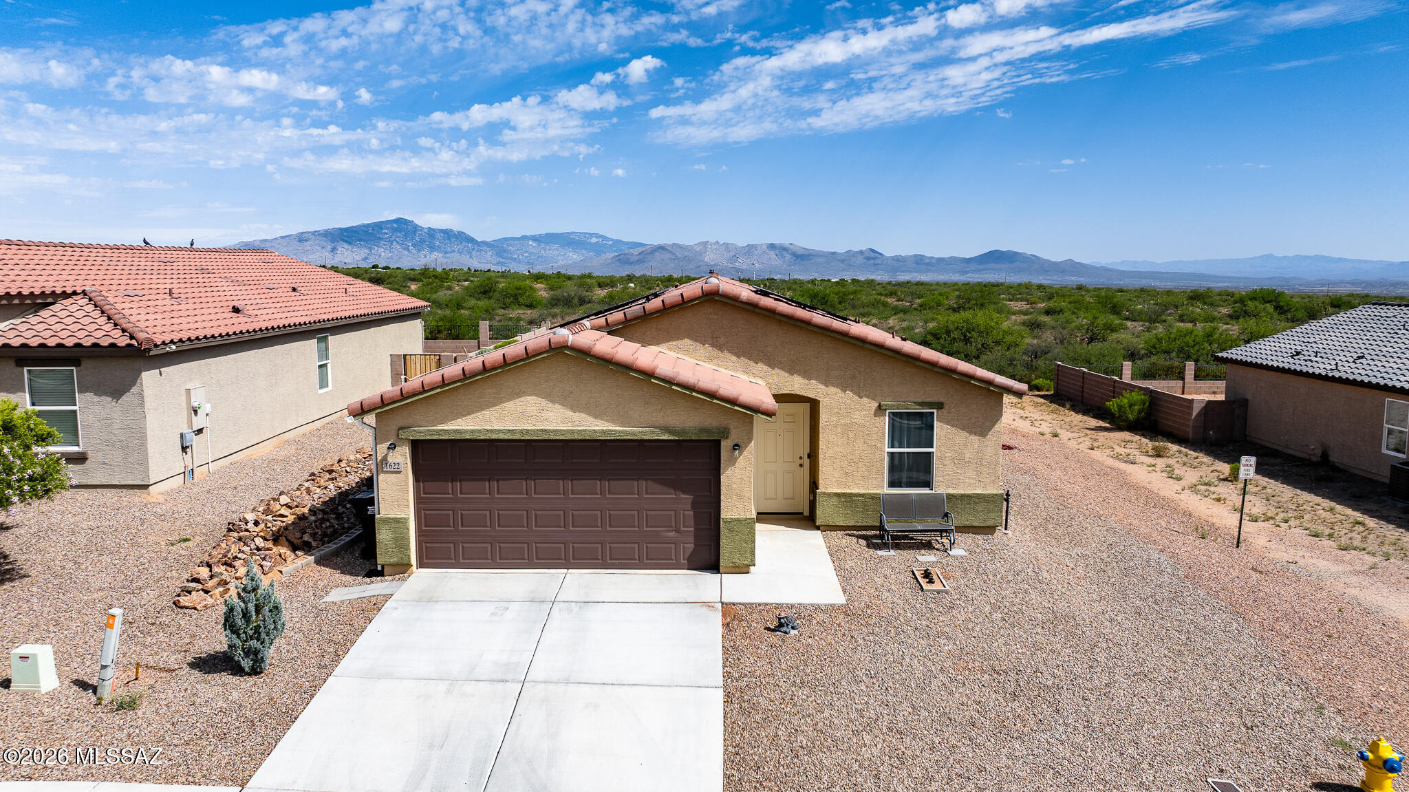 Built in 2022, this beautifully maintained 1,630sqft. home offers 3 bed, 2 bath, and a desirable split floor plan designed for both privacy and functionality. Warm, inviting finishes and abundant natural light create a welcoming atmosphere throughout. The spacious kitchen flows seamlessly into the living and dining areas, making it ideal for everyday living and entertaining. Step outside to enjoy stunning mountain views and a fully landscaped backyard featuring low-maintenance artificial turf, providing year-round beauty without the upkeep. The home also features owned solar, offering energy efficiency and long-term savings without the expense of a lease. With no HOA, you'll enjoy added freedom and flexibility. This home is conveniently designed and move-in ready!
