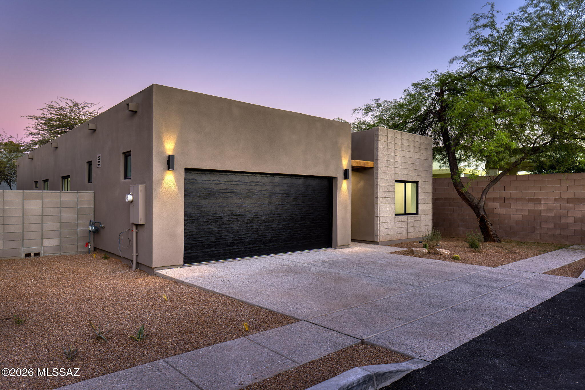 Introducing the second available newly completed 2025 residence at Elmwood, thoughtfully designed to offer modern architecture, refined craftsmanship, and an exceptionally walkable central Tucson lifestyle. While a sister residence has already sold, this newly available home presents a fresh opportunity to own within this limited new-construction offering.

Clean architectural lines and refined finishes define the open floorplan, where the kitchen, dining area, and great room connect seamlessly. The kitchen features custom-crafted cabinetry, premium finishes, and thoughtful storage, setting the tone for the quality found throughout the home.

With three bedrooms plus a versatile den, the layout adapts easily to a range of needs--whether for a home office, media room, fitness space, or guest accommodations. The home also includes three well-appointed full bathrooms and a two-car garage, a rare convenience in this central location.

An expansive covered patio with a warm tongue-and-groove ceiling extends the living area outdoors, creating a welcoming space for dining, entertaining, or quiet relaxation.

Set within walking distance of neighborhood cafés, restaurants, and daily conveniences, this newly completed 2025 residence represents modern desert living in the heart of central Tucson.

Interior photos are of the model home. Warranty information available upon request.