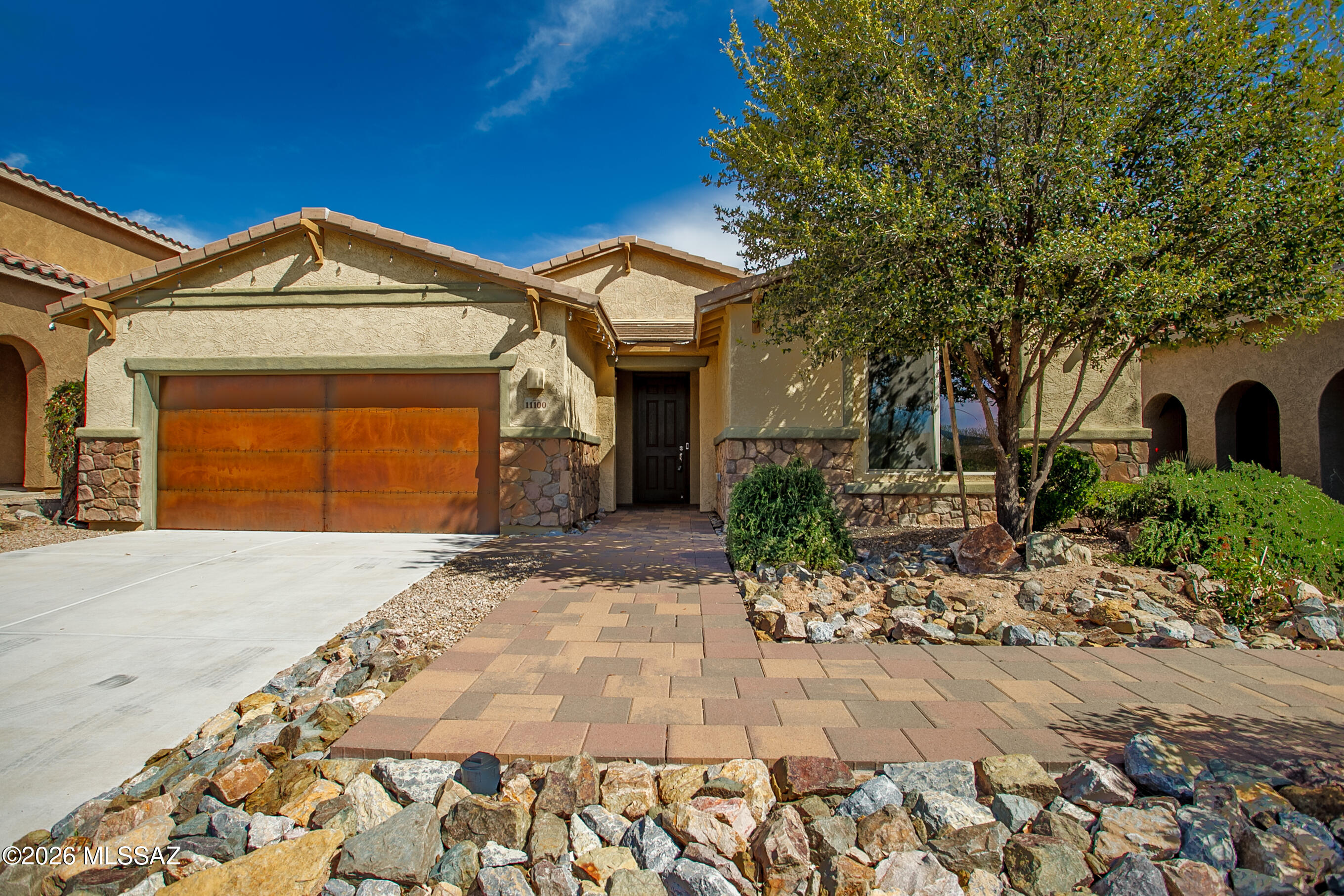 Fantastic opportunity to own fabulous newer home in the heart of Oro Valley! Gorgeous Meritage Model home 3 Bed 2.5 Bath 3-car garage loaded w/many impeccable upgrades located in the desirable gated Estates Capella community. Open concept, high vaulted ceiling, lots of big windows w/natural lighting. Charming design with stylish tiled backsplash in kitchen & bathrooms, undercabinet lighting, elegant chandeliers, wood-plank tiled flooring, plush upgraded carpet. Stunning upgraded kitchen with large island feature quartz counter, SS appliances, double ovens & walk-in pantry. Spacious living room, family room, formal dining room, breakfast bar & built-in desk/office space. Gorgeous primary suite w/lots of stunning factors including accent wall, modern barn doors & charming light fixtures. Amazing resort-like primary en-suite bathroom offers double vanity, upgraded tiled walk-in shower, big garden tub, big walk-in closet. Energy efficient home with insulated windows, water-efficient faucets & smart-thermostat. Big laundry room offers utility sink, tons of built-in cabinets & counters. Attached 3 car tandem garage. Beautifully landscaped backyard features tiled patio, brick pavers, pergola with attached swings, built-in firepit, water feature & various citrus trees. Premium private lot backs up to a wash. Community playground & park. Convenient location, just minutes from businesses, shopping and restaurants. Don't miss out on this OV gem!