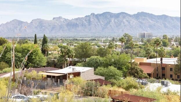 Wonderful opportunity to build your SINGLE-FAMILY HOME or RENTAL INVESTMENT PROPERTY in this, rapidly developing, hillside  neighborhood. just west of I-10, overlooking Menlo Park and the Mercado San Augustin. Five minutes from Tucson's downtown employment hub, St Mary's Hospital and the University of Arizona nearby. This elevated site provides BREATHTAKING, PANORAMIC SUNSET VIEWS of the Catalina Mountains as well as evening views of the Tucson city lights. Enjoy the 4th of July fireworks at A Mountain from your deck and take in the desert splendor while hiking the nearby, winding trails at Tumamoc Hill. All city utilities in the newly paved street. Incl. are Pima Co approved plans for a 2-unit rental bldg; each with 2br, 2ba units; providing buyer with SIGNIFICANT SAVINGS. PRICE IS FIRM.