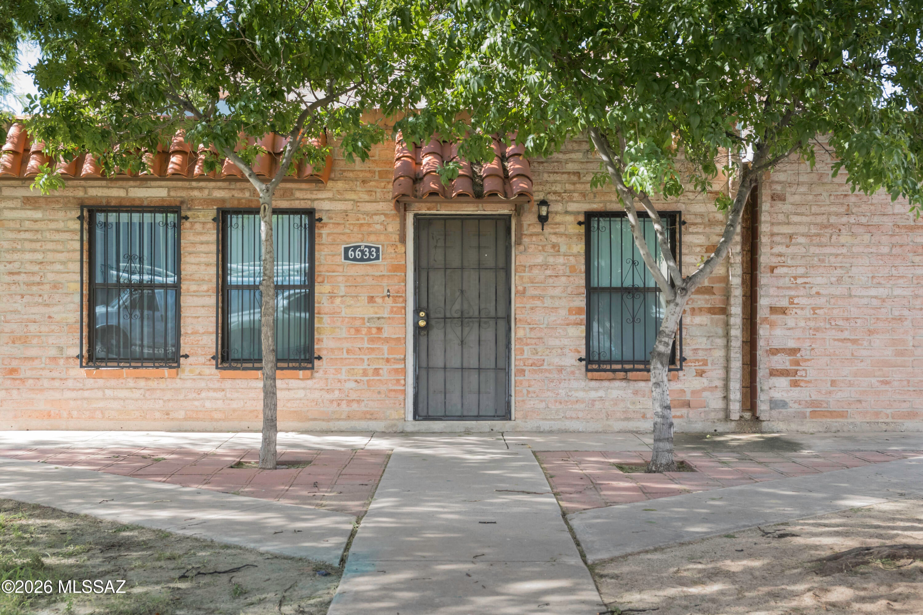 Welcome home to this delightful, single-story 2-bedroom, 1-bathroom townhouse located in the highly desirable and established community of The Meadows on Tucson's vibrant East Side. Perfectly situated as an end or frontline Unit A, this home offers an excellent blend of comfort, privacy, and low-maintenance living.