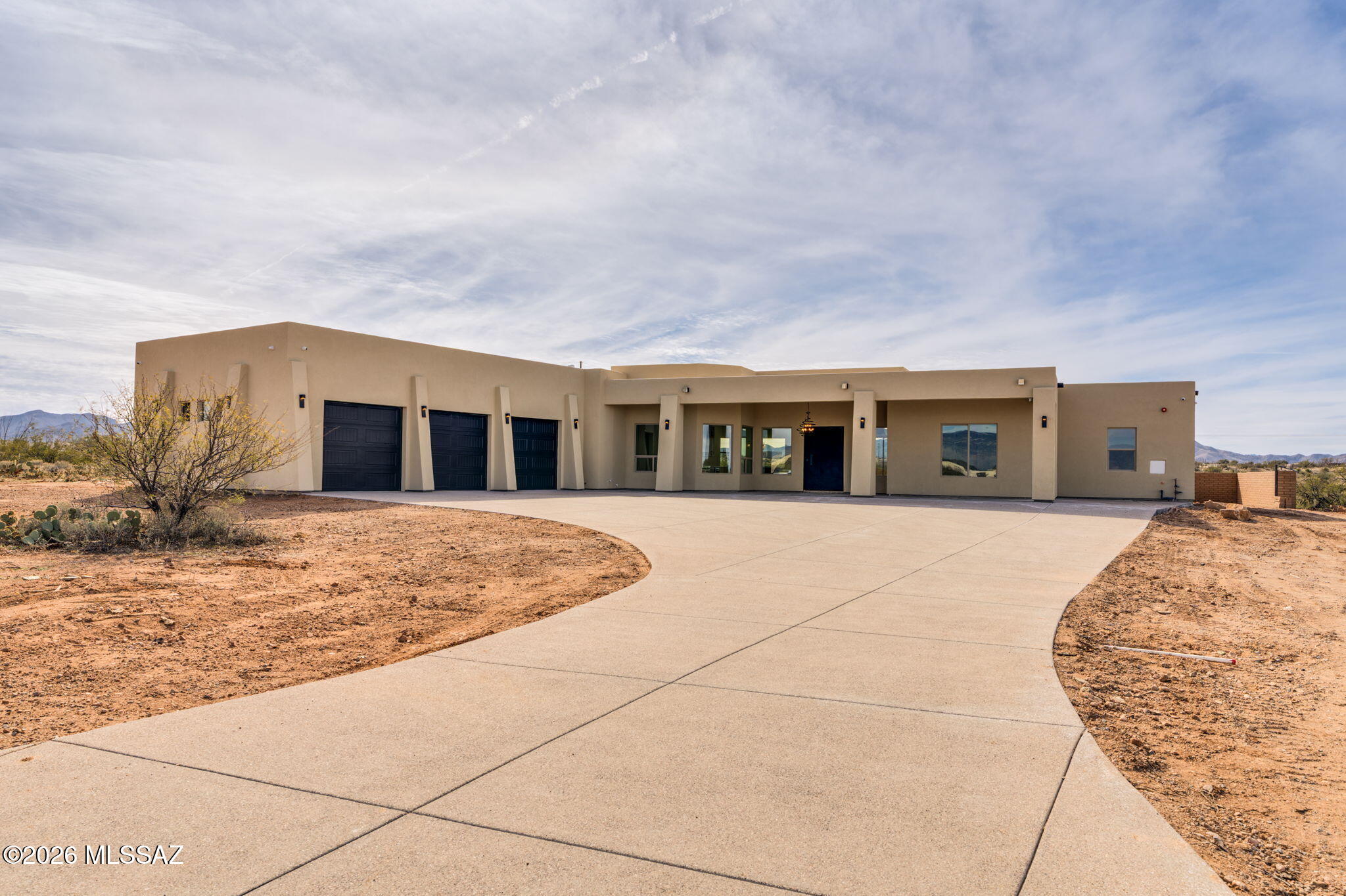Custom-built home on a 1.31-acre lot offering 3,036 sq ft of living space and 5,181 total sq ft including patios and garage areas. Features 4 bedrooms, 3 bathrooms, and a dedicated office.
Open layout with 12 ft ceilings in the main living areas and 10 ft ceilings throughout. Chefs kitchen with a quartz island, stove, and stainless steel appliances. Foam insulation for energy efficiency, 12ft sliding glass door to the patio, and seamless indoor-outdoor living. 3-car garage with 11ft ceilings, security cameras, slump block construction, synthetic stucco exterior, and exposed aggregate driveway.  Space, quality, and efficiency. built to last.