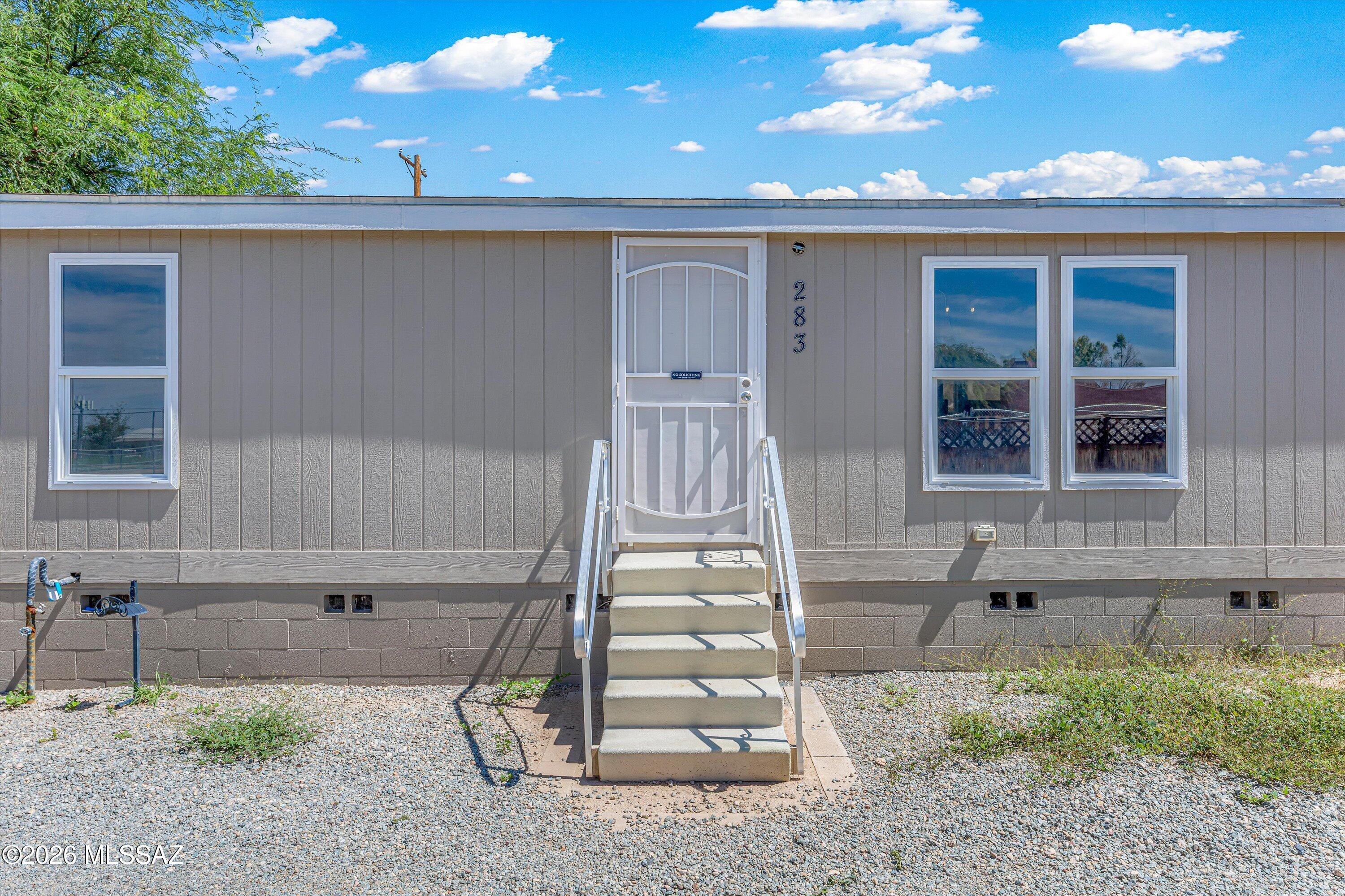 Welcome home to this spacious 4-bedroom, 2-bath manufactured home situated on almost a quarter of an acre! Featuring a desirable split-bedroom floor plan, this home offers plenty of space and flexibility. The fully gated property provides added privacy, while the spacious backyard is a blank canvas with endless possibilities. Create an outdoor entertaining area, garden, play space, or make it your own. Conveniently located just minutes from the Tucson Marketplace, with Costco, Walmart, shopping, dining, and entertainment nearby. Easy access to I-10 makes getting around Tucson a breeze. This home offers so much potential!