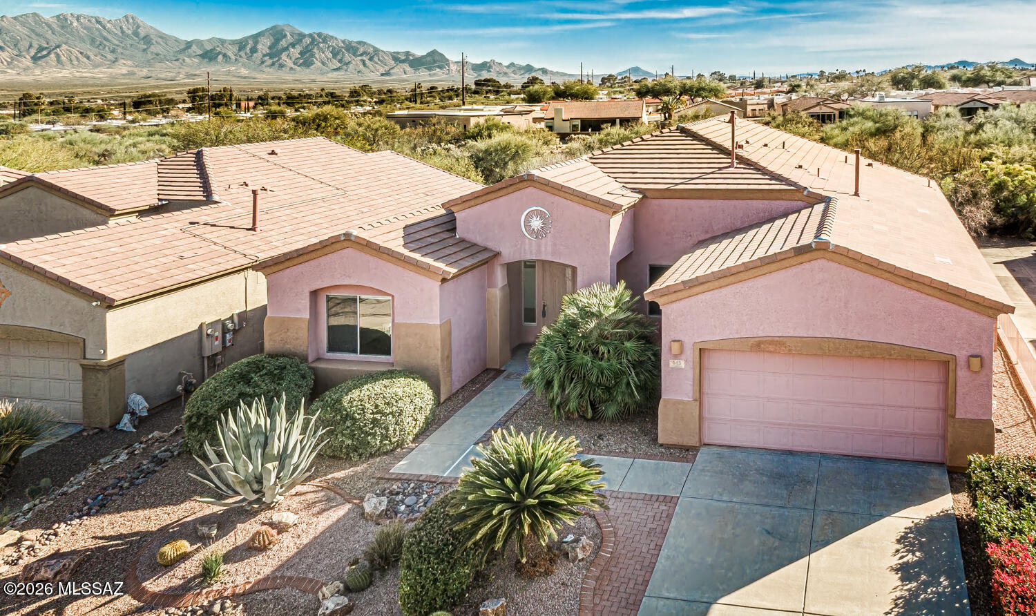 Views of the Santa Rita Mountains, Beautiful Las Campanas Home in the Heart of Green Valley. Great Room, Formal Living/Dining Room, 2 Bedrooms, 2 Baths, Den/Office, large 2 Car Garage and a large Rear Yard. Beehive Fireplace, Tile/Carpet Flooring, Ceiling Fans and many more great features. A private rear yard that would be great for entertaining and it backs up to Open Desert (HOA) with Views of the Santa Rita Mountains. Must See this home.