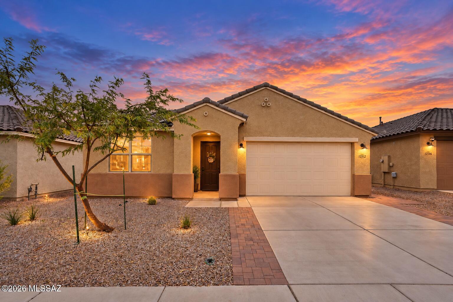 The upgrades are done. The backyard is finished. All that's missing is you! Built in 2024, this immaculate Mattamy Cobalt floor plan offers 2,334 SF, 4 beds, 3 baths, & a desirable split-bedroom design with a Jack & Jill bath between Bedrooms 2 & 3. The gourmet kitchen features built-in stainless appliances, gas cooktop, oversized island with seating, and walk-in pantry, opening to a spacious great room perfect for gathering. Escape to the private owner's suite with a spa-like tiled walk-in shower and HUGE walk-in closet. Skip the expense of finishing a backyard because this one is already complete with turf, pavers, wrought iron view fencing, common area behind, and peek-a-boo mountain views. Water softener, filtration system, security door, 220V garage outlet & Paws & Claws Park nearby!