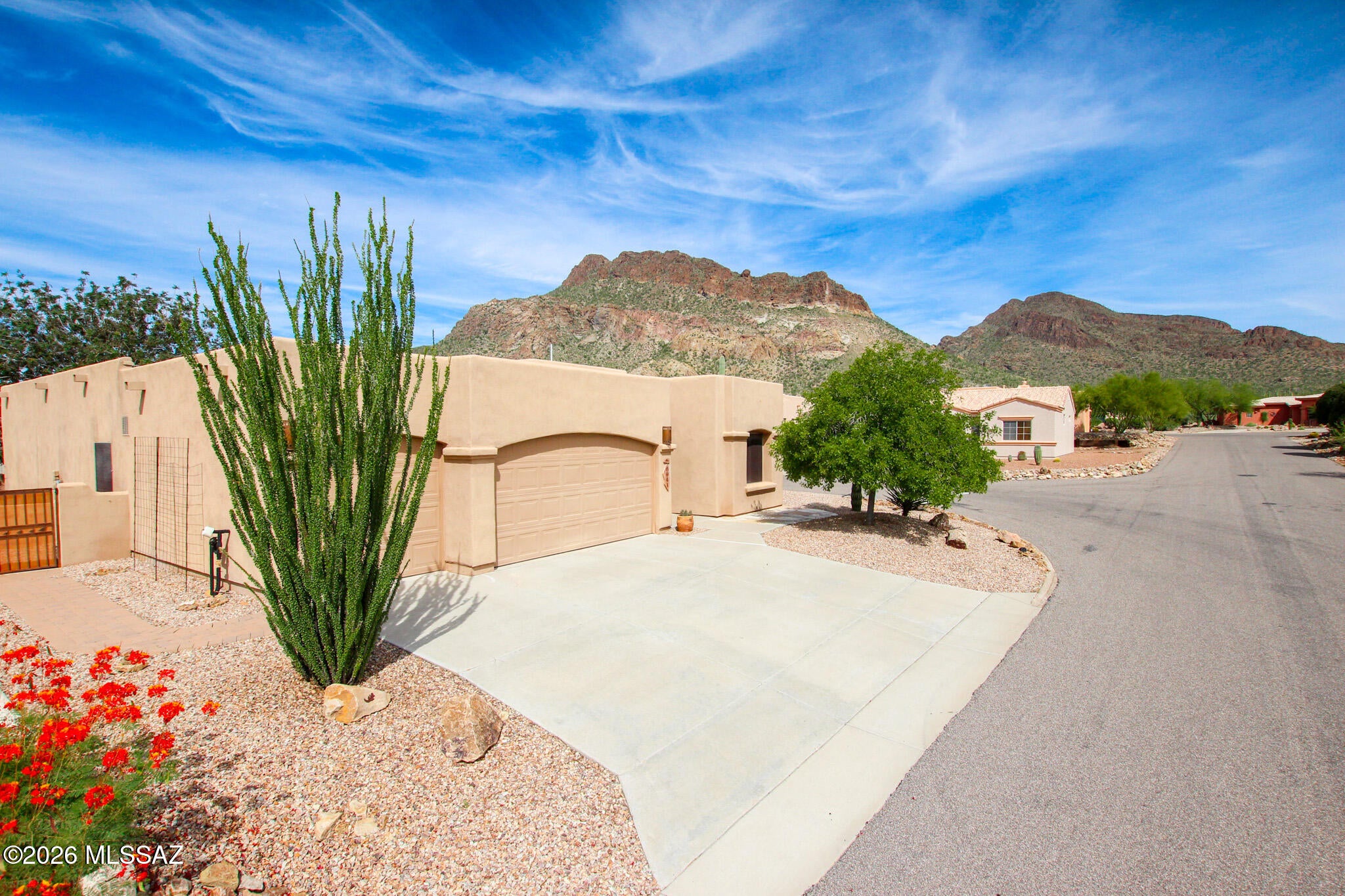 Beautifully maintained, move-in ready home in Tucson Estates II! This 3BR/2BA, 1,947 sq. ft. home features a 3-car garage, mountain views, high ceilings, split-bedroom floor plan, granite countertops, stainless appliances, gas fireplace, and covered patio. Enjoy community amenities including pool, spa, pickleball, tennis, and park. Energy-efficient leased solar, newer HVAC & water heater, plus thoughtful upgrades throughout!