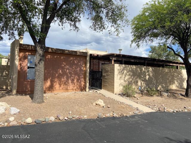 2 Bedroom, 2 bath townhome in great location.  Walking distance to Udall Recreation Center, near all amenities including hospitals.  Two car garage, two covered patio areas, nice kitchen with eat in area.  Living room has a wood burning fireplace and there is a community pool.  Needs some TLC but great value.  Take a look.