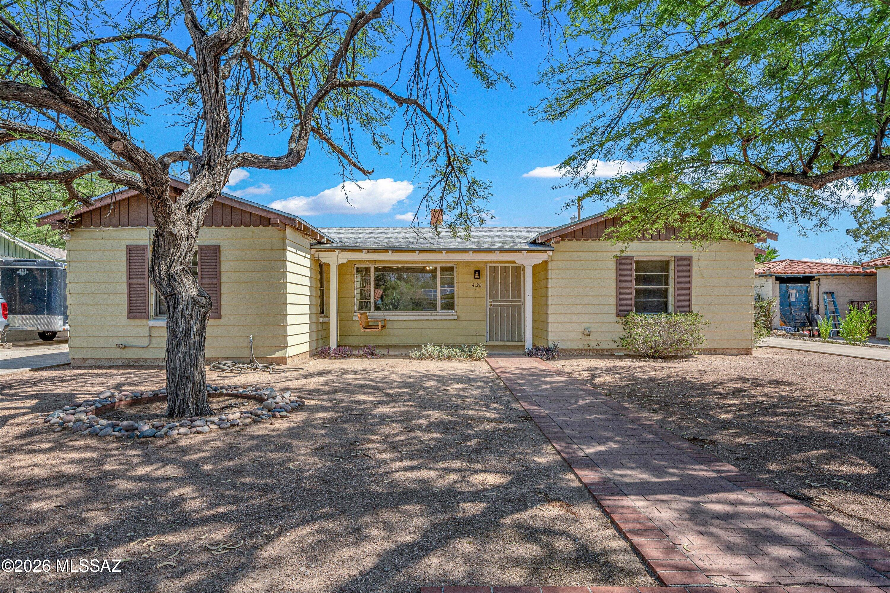 Welcome to this centrally located gem nestled in a quiet, established neighborhood. The main home features 3 bedrooms, 2 baths, and a bonus room perfect for a home office, den, or AZ room, the possibilities are endless. As an added bonus, a 1982 built guest house with 1 bedroom and 1 bath sits on the property, offering incredible flexibility. Guest House is occupied at $875/month, it's a ready made income stream. Ideal for investors or homeowners looking to offset their mortgage. Enjoy ample parking for guests, all in a convenient location close to everything the city has to offer while maintaining the peace and quiet. Whether you're looking for a multi-generational living situation, a savvy investment property, or a home with room to grow, this property checks all of the boxes.