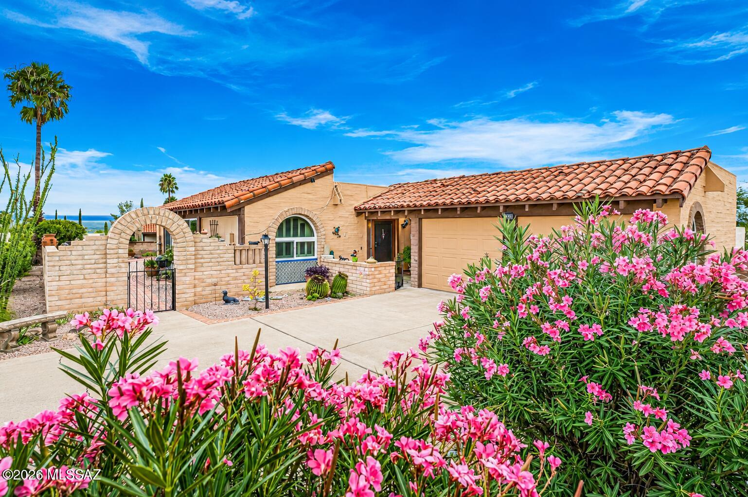 Embrace serene desert haven, in this charming and unique home nestled in the heart of an age-restricted community in Green Valley, AZ. Boasting 2 cozy bedrooms and 2 bathrooms, plus a bonus AZ room, this property is a perfect blend of comfort & convenience. Imagine waking up to the awe-inspiring views of the Santa Rita Mountains and Elephant Head Mt., visible from your very own primary suite, which includes a slider that opens to a private covered patio. The second bedroom is equally inviting w/ convenient access to the hallway bath: a split bedroom plan. This home is perched on a spacious, elevated, private corner lot,
a block-fenced yard with an entry courtyard that sets the tone for the warm & inviting interior and provides the ideal space for your oasis. The heart of the home is the cozy great room and the bright kitchen, flooded with natural light through newer windows, perfect areas for relaxation or entertaining. The kitchen and a designated dining area cater to casual and formal meals. A bonus AZ room offers flexibility, such as a den, media room, or exercise space, with access to the yard and side patio, enhancing your indoor-outdoor living experience. For your convenience, a two-car garage ensures your vehicles are sheltered from the elements. The property is close to workout facilities, pool, spa, tennis, pickleball, and golf amenities, your active lifestyle is catered for without compromise. This is more than just a home; it's a lifestyle waiting to be cherished in Green Valley's sun-soaked splendor.